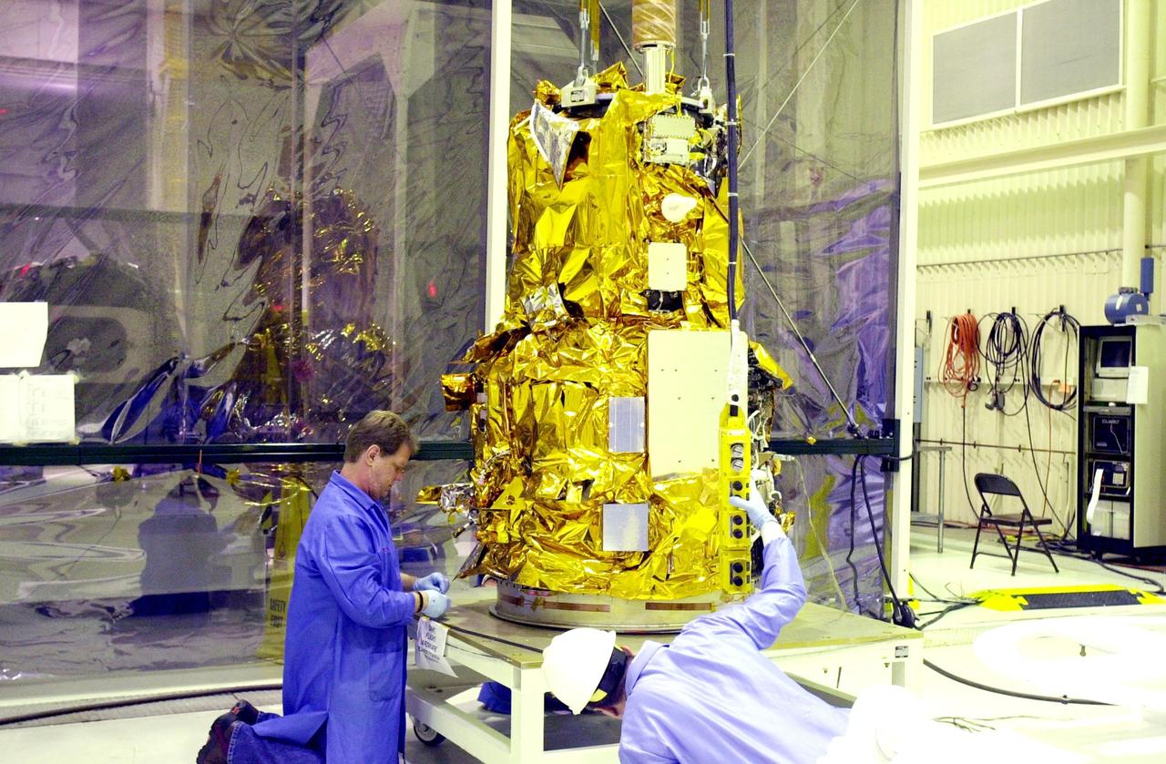 KENNEDY SPACE CENTER, FLA. - At Vandenberg Air Force Base in California, the Demonstration of Autonomous Rendezvous Technology (DART) spacecraft is placed on a work stand for processing activities.  The spacecraft was developed for NASA by Orbital Sciences Corporation in Dulles, Va., to prove technologies for locating and maneuvering near an orbiting satellite.  DART will be launched on a Pegasus launch vehicle. At about 40,000 feet over the Pacific Ocean, the Pegasus will be released from Orbital’s Stargazer L-1011 aircraft, fire its rocket motors and boost DART into a polar orbit approximately 472 miles by 479 miles. Once in orbit, DART will rendezvous with a target satellite, the Multiple Paths, Beyond-Line-of-Site Communications satellite, also built by Orbital Sciences. DART will then perform several close proximity operations, such as moving toward and away from the satellite using navigation data provided by onboard sensors.  DART is scheduled for launch no earlier than Oct. 18.