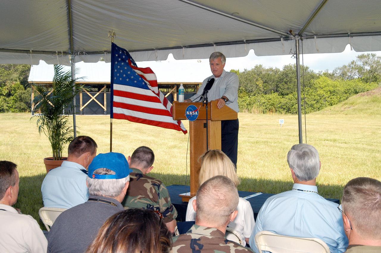 KENNEDY SPACE CENTER, FLA. - Center Director Jim Kennedy addresses guests at the ribbon cutting for the Enhanced Firing Range on Schwartz Rd. at Kennedy Space Center.  NASA’s Federal Law Enforcement Training Academy’s firing range has been upgraded to include a “rifle-grade” shoot house, a portable, tactical “shoot-back” trailer for cover and concealment drills, automated running targets and a new classroom facility.  They are added to the existing three firearms ranges, “pistol-grade” shoot house, obstacle course and rappel tower.   NASA’s Security Management and Safeguards Office funded the enhancements in order to improve ability to train the KSC security force and to support local, state and federal law enforcement agencies in Homeland Security.