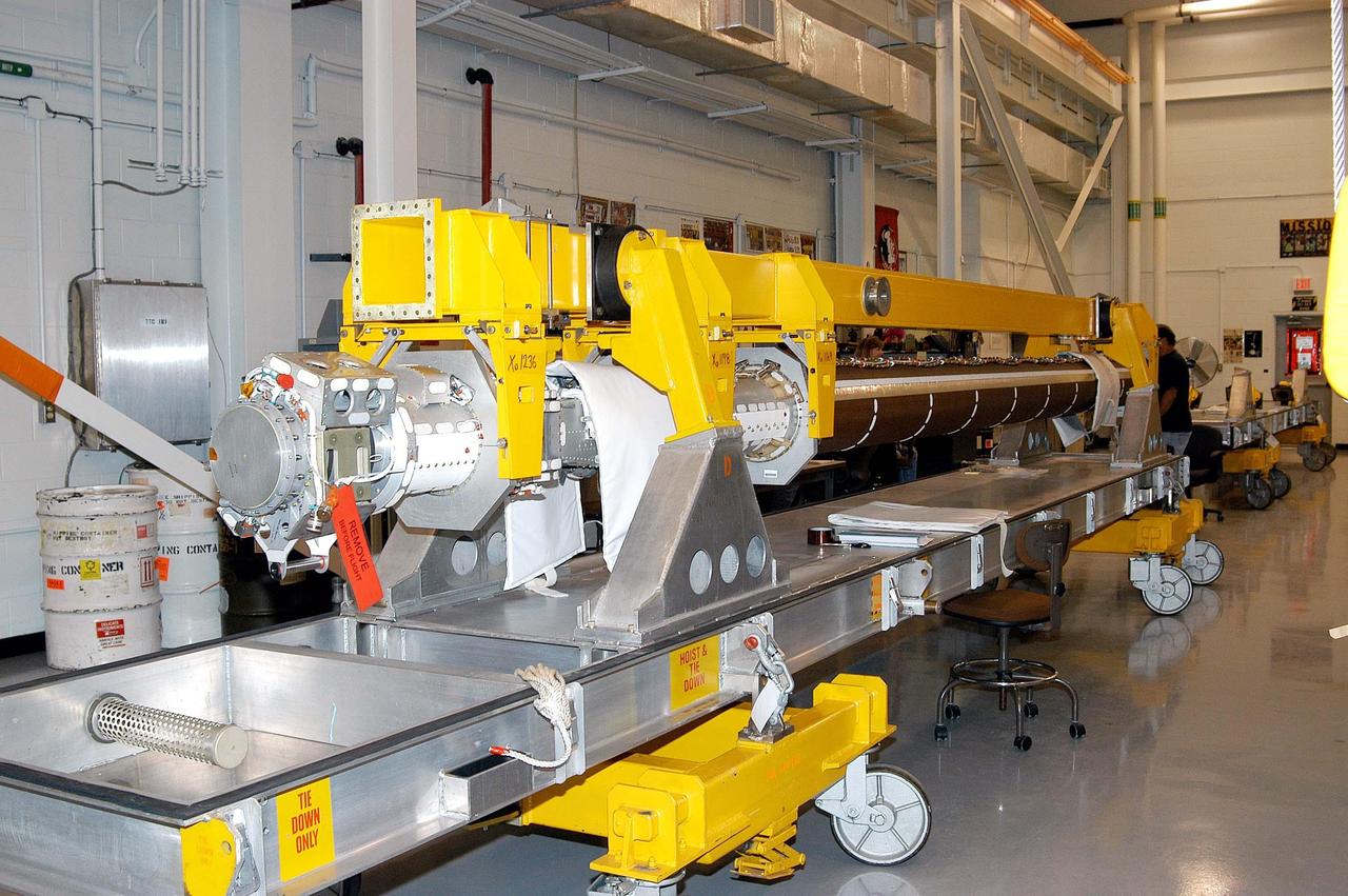 KENNEDY SPACE CENTER, FLA. - The Remote Manipulator System (RMS), also known as the Canadian robotic arm, for the orbiter Discovery has arrived at KSC’s Vehicle Assembly Building Lab.  The RMS is used to deploy and retrieve payloads, provide a mobile extension ladder or foot restraints for crew members during extravehicular activities; and to aid the flight crew members in viewing surfaces of the orbiter or payloads through a television camera on the RMS. The arm is also serving as the base for the new Orbiter Boom Sensor System (OBSS), one of the safety measures for Return to Flight, equipping the Shuttle with cameras and laser systems to inspect the Shuttle’s Thermal Protection System while in space.  Discovery is scheduled for a launch planning window of March 2005 on mission STS-114.