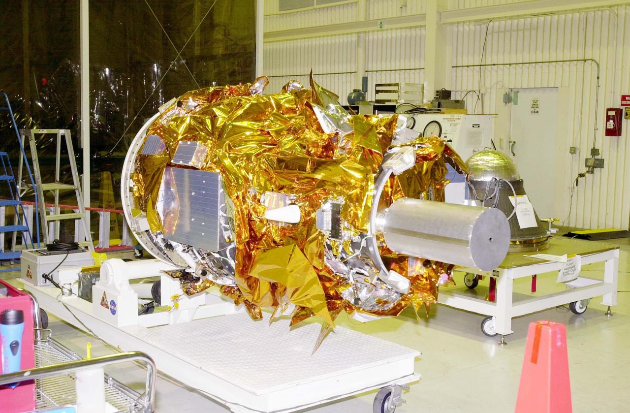 KENNEDY SPACE CENTER, FLA. - At Vandenberg Air Force Base in California, the Demonstration of Autonomous Rendezvous Technology (DART) spacecraft is ready for mating with the upper stage of the Orbital Sciences Pegasus XL behind it (right). DART was designed and built for NASA by Orbital Sciences Corporation as an advanced flight demonstrator to locate and maneuver near an orbiting satellite. DART weighs about 800 pounds and is nearly 6 feet long and 3 feet in diameter. The Pegasus XL will launch DART into a circular polar orbit of approximately 475 miles. DART is designed to demonstrate technologies required for a spacecraft to locate and rendezvous, or maneuver close to, other craft in space. Results from the DART mission will aid in the development of NASA’s Crew Exploration Vehicle and will also assist in vehicle development for crew transfer and crew rescue capability to and from the International Space Station.