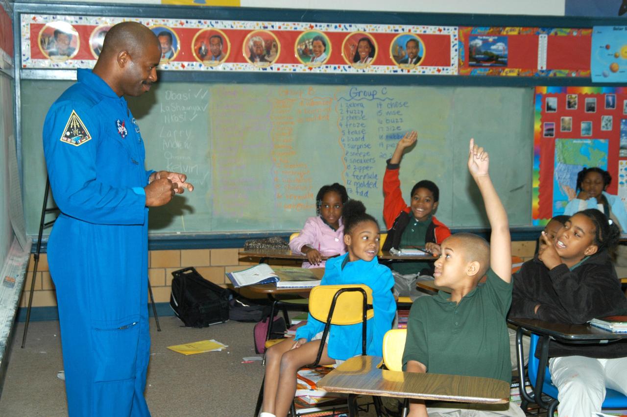 KENNEDY SPACE CENTER, FLA. - At University Community Academy in Atlanta, a NASA Explorer School, astronaut Leland Melvin talks to students. Melvin accompanied KSC Deputy Director Dr. Woodrow Whitlow Jr., who was visiting the school to share the vision for space exploration with the next generation of explorers. Whitlow talked with students about our destiny as explorers, NASA’s stepping stone approach to exploring Earth, the Moon, Mars and beyond, how space impacts our lives, and how people and machines rely on each other in space. Melvin talked about the importance of teamwork and what it takes for mission success.