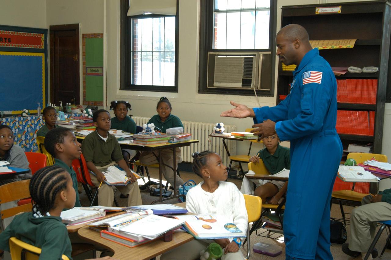 KENNEDY SPACE CENTER, FLA. - At University Community Academy in Atlanta, a NASA Explorer School, astronaut Leland Melvin talks to students. Melvin accompanied KSC Deputy Director Dr. Woodrow Whitlow Jr., who was visiting the school to share the vision for space exploration with the next generation of explorers. Whitlow talked with students about our destiny as explorers, NASA’s stepping stone approach to exploring Earth, the Moon, Mars and beyond, how space impacts our lives, and how people and machines rely on each other in space. Melvin talked about the importance of teamwork and what it takes for mission success.