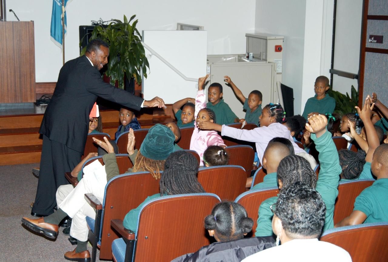 KENNEDY SPACE CENTER, FLA. - At University Community Academy in Atlanta, a NASA Explorer School, KSC Deputy Director Dr. Woodrow Whitlow Jr. interacts with students during his presentation. Dr. Whitlow was visiting the school to share the vision for space exploration with the next generation of explorers. Whitlow talked with students about our destiny as explorers, NASA’s stepping stone approach to exploring Earth, the Moon, Mars and beyond, how space impacts our lives, and how people and machines rely on each other in space.
