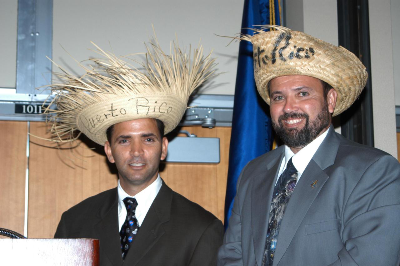 KENNEDY SPACE CENTER, FLA. - Felix A. Soto Toro (left) and Joseph Tellado (right) get into the spirit of KSC’s annual Hispanic American Heritage luncheon. The theme was “Hispanic Americans Making a Difference.” Soto Toro and Tellado are co-chairs of the event hosted by the Hispanic Employment Program Working Group. The annual event helps employees reflect on the extensive contributions Hispanics have made to KSC, NASA and the nation. The guest speaker was Charles A. Gambaro, NASA KSC engineering lead and Combat Engineering Group commander, who recently returned from Operation Iraqi Freedom.