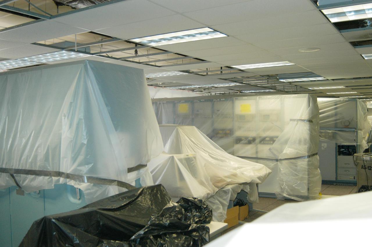 KENNEDY SPACE CENTER, FLA. - Large pieces of equipment in the Processing Control Center are covered in plastic in preparation for the arrival of Hurricane Jeanne, expected to impact Central Florida Sunday. This is the fourth hurricane in 45 days to make landfall somewhere in the state.