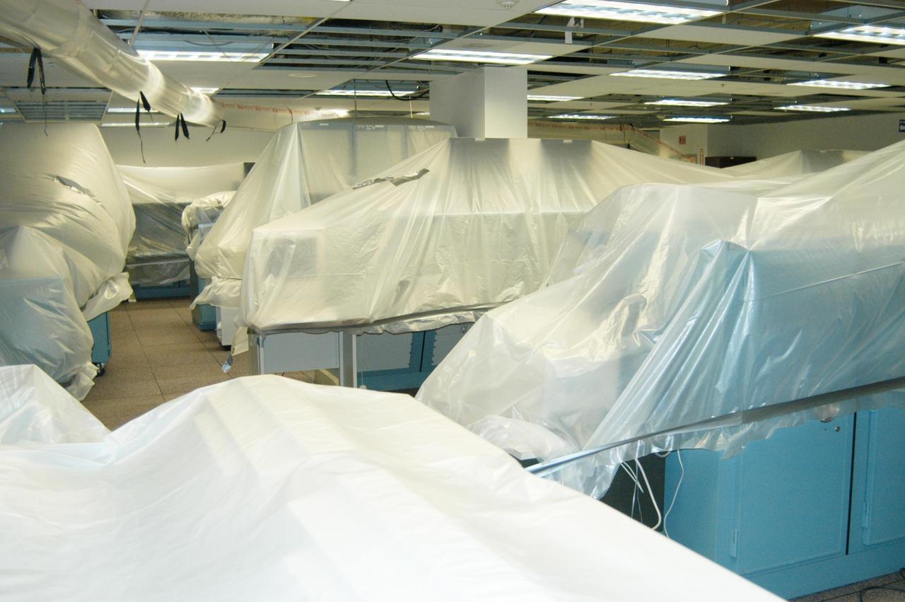 KENNEDY SPACE CENTER, FLA. - Large pieces of equipment in the Processing Control Center in the Launch Complex 39 Area are covered in plastic in preparation for the arrival of Hurricane Jeanne, expected to impact Central Florida Sunday. This is the fourth hurricane in 45 days to make landfall somewhere in the state.