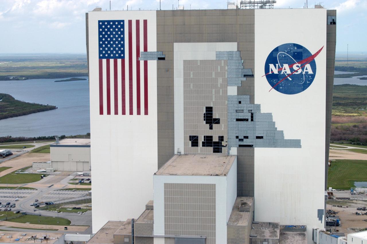 KENNEDY SPACE CENTER, FLA. - This view taken from a helicopter shows damage to the Vehicle Assembly Building at KSC following the category 3 Hurricane Jeanne. The storm barreled through Central Florida Sept. 25-26 from the southeast. The VAB had lost 850 panels from the south wall during Hurricane Frances. Twenty-five additional panels were pulled off the east wall by the winds from Jeanne. This was the fourth hurricane in 6 weeks to batter the state.