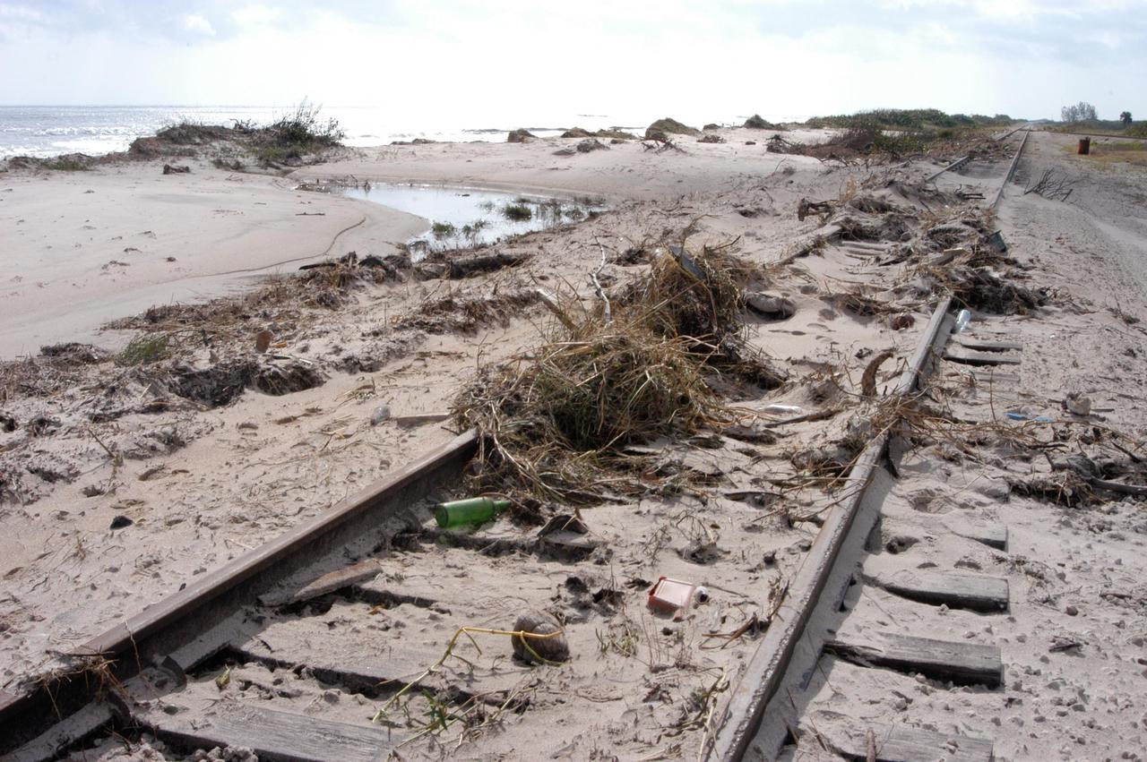 KENNEDY SPACE CENTER, FLA. - Debris litters the railroad track that runs along the shoreline east of KSC’s launch pads.  The dunes were assaulted by storm surge and raging winds from category 3 Hurricane Jeanne, which barreled through Central Florida Sept. 25-26 from the southeast.  Jeanne was the fourth hurricane in 6 weeks to batter the state.