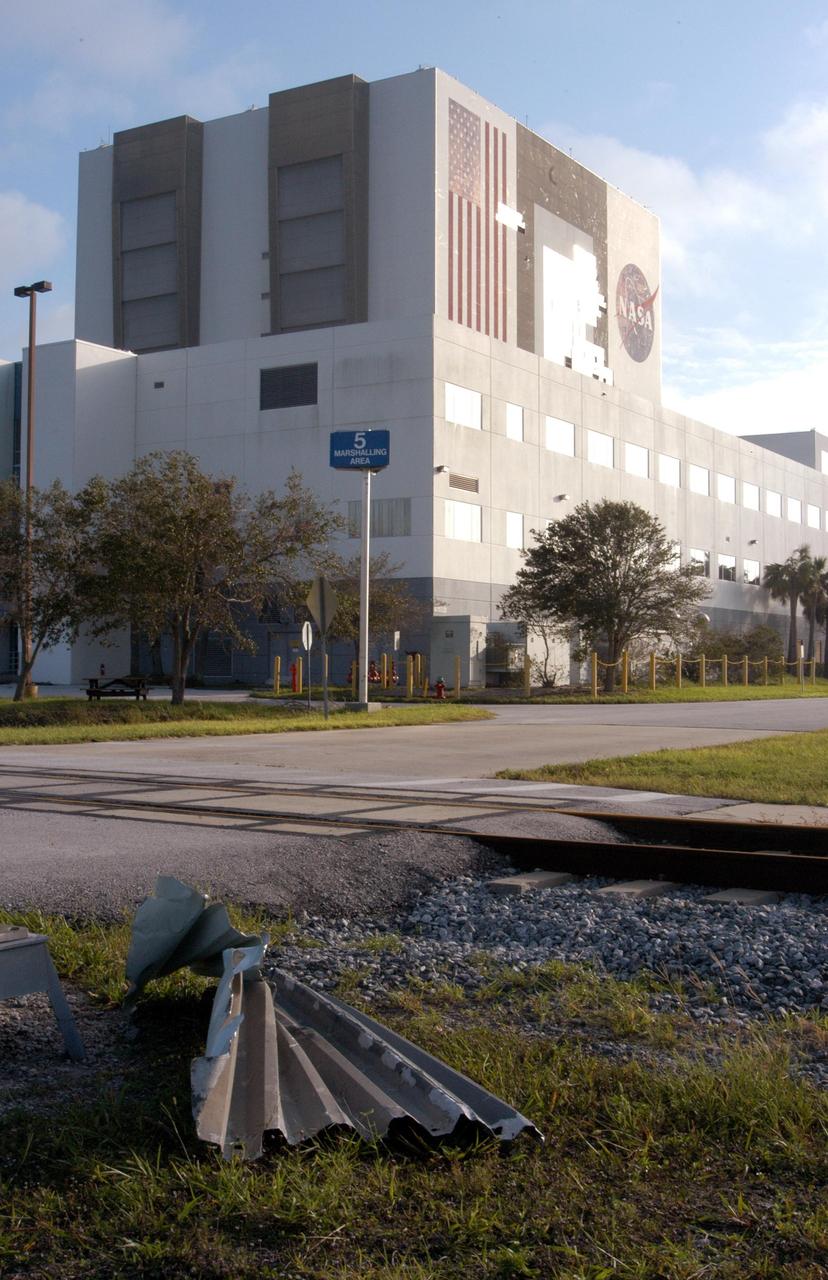 KENNEDY SPACE CENTER, FLA. - In the foreground lies a panel pulled from the wall of the Vehicle Assembly Building at KSC during the category 3 Hurricane Jeanne. The storm barreled through Central Florida Sept. 25-26 from the southeast. The VAB had lost 850 panels from the south wall during Hurricane Frances. Twenty-five additional panels were pulled off the east wall by the winds from Jeanne. This was the fourth hurricane in 6 weeks to batter the state.