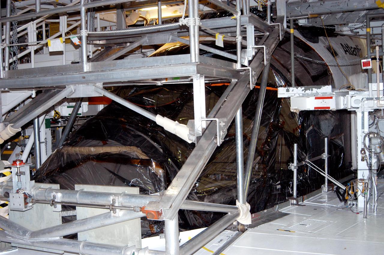 KENNEDY SPACE CENTER, FLA. - In the Orbiter Processing Facility, the nose of orbiter Atlantis is covered in plastic, part of the preparation to protect the vehicles from possible damage by Hurricane Jeanne.  The storm ravaged Central Florida for 21 hours as it crossed the shoreline on the east coast Sept. 25-26.  Hurricane Jeanne was the fourth hurricane in 6 weeks to batter the state.