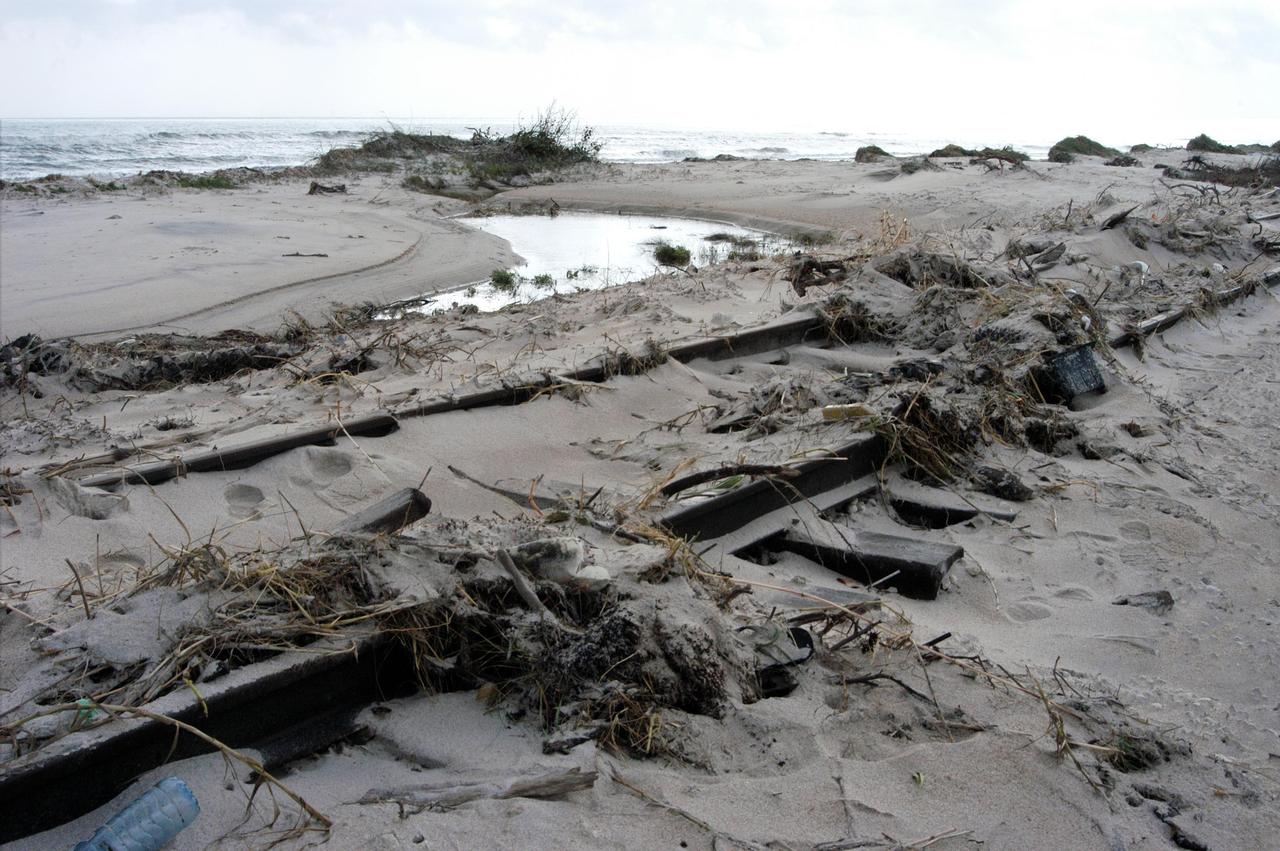 KENNEDY SPACE CENTER, FLA. - The railroad tracks north of Launch Pad 39A are covered with sand and debris left behind by the storm surge and winds of category 3 Hurricane Jeanne.  The storm ravaged Central Florida for 21 hours as it crossed the shoreline on the east coast Sept. 25-26.  Hurricane Jeanne was the fourth hurricane in 6 weeks to batter the state.