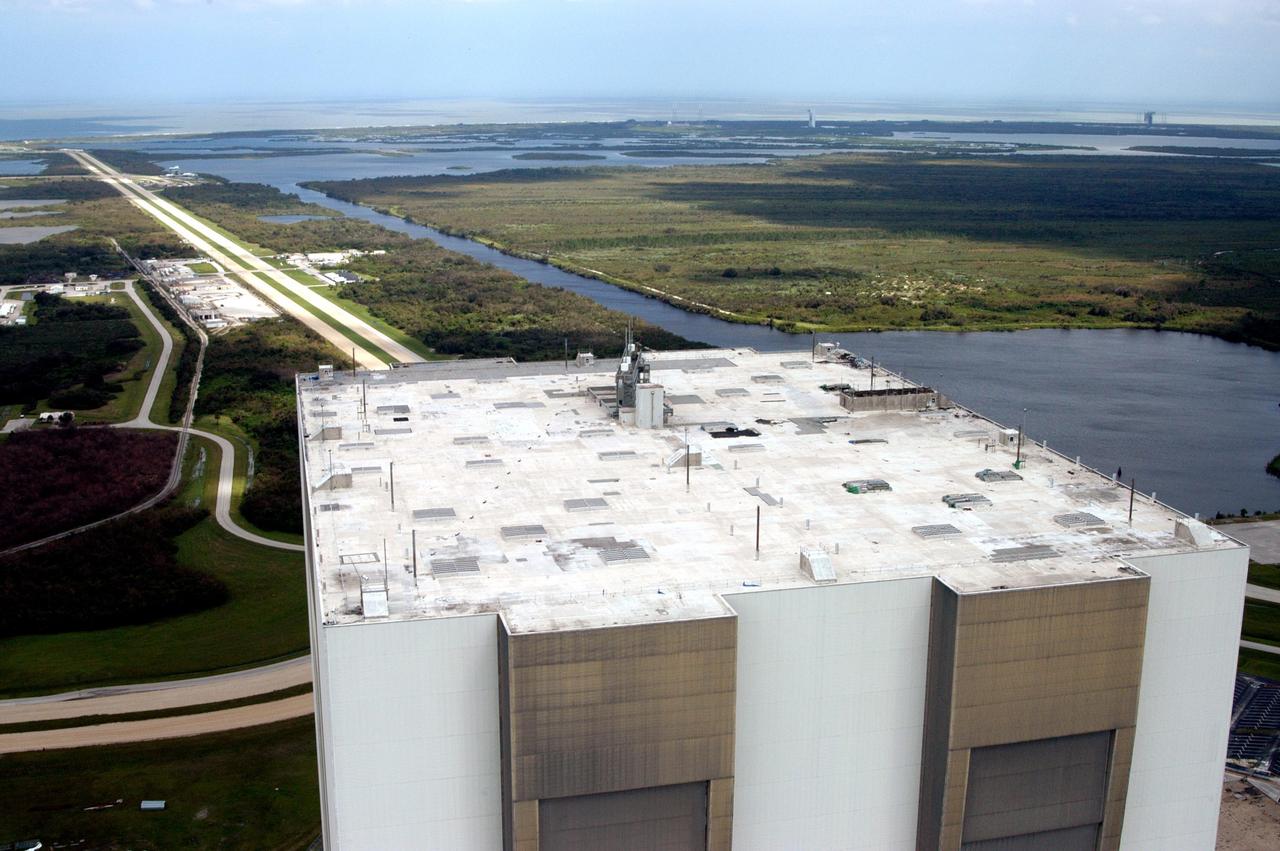 KENNEDY SPACE CENTER, FLA. - An aerial view of the Vehicle Assembly Building at KSC shows damage to the roof inflicted by both Hurricane Frances and the category 3 Hurricane Jeanne.  The latter storm barreled through Central Florida Sept. 25-26, the fourth hurricane in 6 weeks to batter the state.