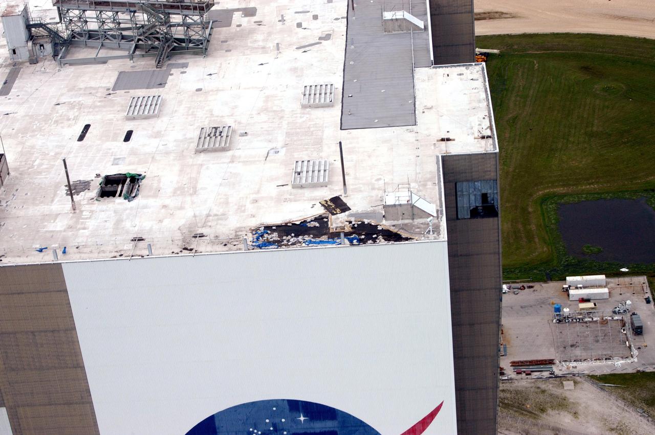 KENNEDY SPACE CENTER, FLA. - An aerial view of the Vehicle Assembly Building at KSC shows damage to the roof inflicted by both Hurricane Frances and the category 3 Hurricane Jeanne. The latter storm barreled through Central Florida Sept. 25-26, the fourth hurricane in 6 weeks to batter the state.