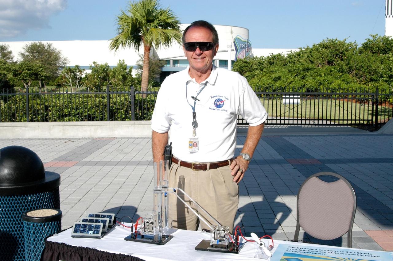 KENNEDY SPACE CENTER, FLA. - Herman Everett is ready to explain the use of hydrogen in a fuel cell vehicle during an exhibit by the Ford Motor Company of their modified Ford Focus.   The exhibit was a response to inquiries about fuel cell vehicles during KSC’s Environmental and Energy Awareness week in April 2004.
