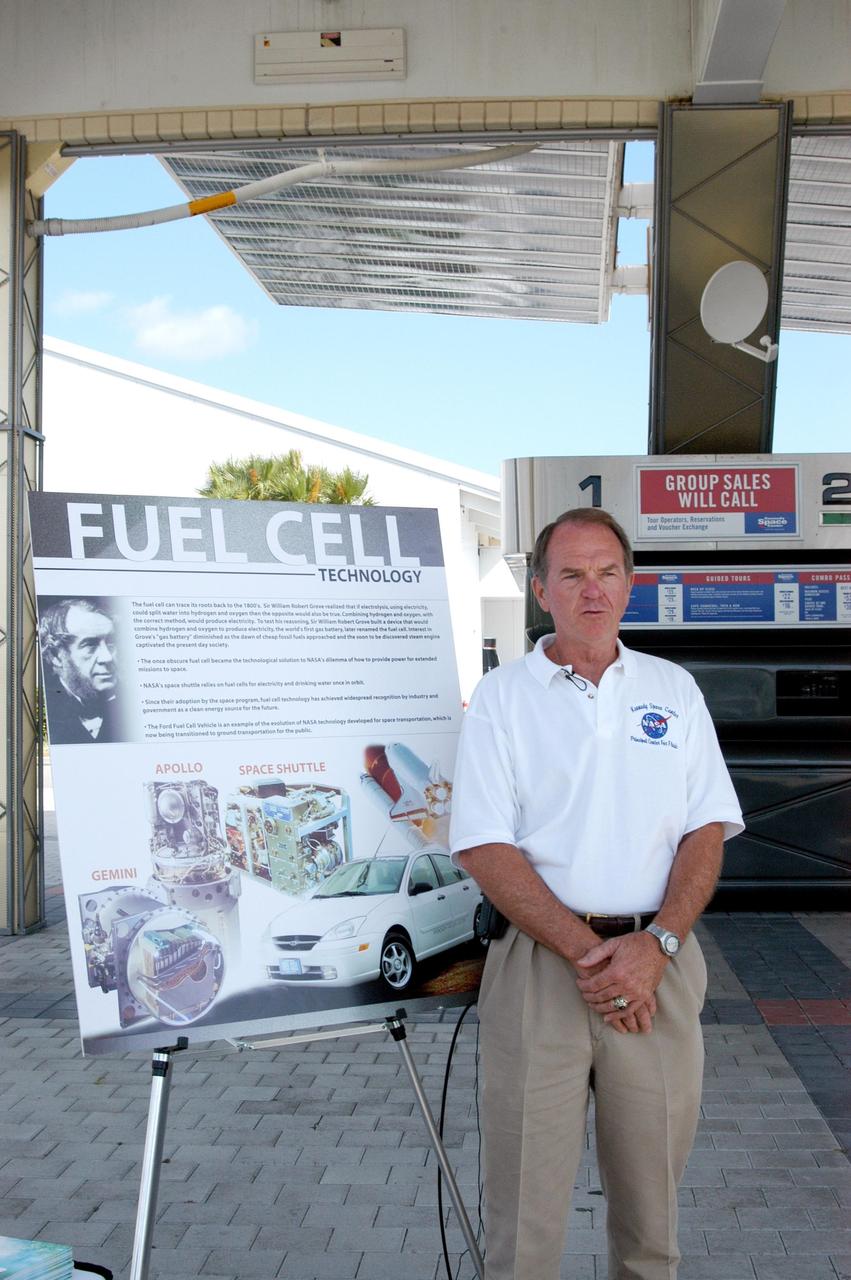 KENNEDY SPACE CENTER, FLA. - Herman Everett explains the use of hydrogen in a fuel cell vehicle during an exhibit by the Ford Motor Company of their modified Ford Focus.   The exhibit was a response to inquiries about fuel cell vehicles during KSC’s Environmental and Energy Awareness week in April 2004.