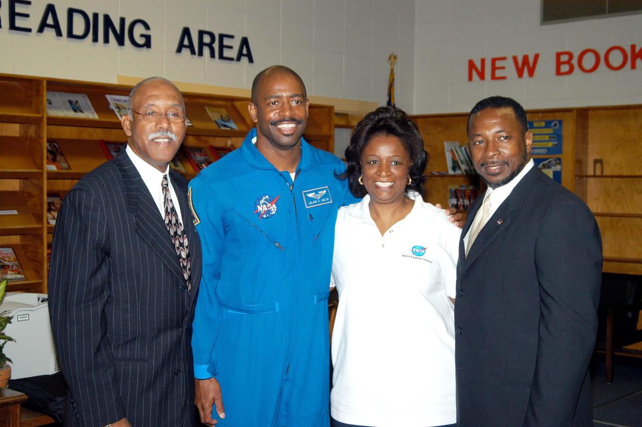 KENNEDY SPACE CENTER, FLA. - (From left) Dr. Julian Earls, director of NASA Glenn Research Center, astronaut Leland Melvin, Sara Thompson, team lead, and KSC Deputy Director Dr. Woodrow Whitlow Jr. pose for a photo at Ronald E. McNair High School in Atlanta, a NASA Explorer School, after a presentation. Dr. Whitlow visited the school to share The vision for space exploration with the next generation of explorers. Whitlow talked with students about our destiny as explorers, NASA’s stepping stone approach to exploring Earth, the Moon, Mars and beyond, how space impacts our lives, and how people and machines rely on each other in space. Dr. Earls discussed the future and the vision for space, plus the NASA careers needed to meet the vision. Melvin talked about the importance of teamwork and what it takes for mission success.