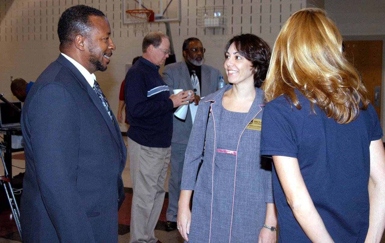 KENNEDY SPACE CENTER, FLA. - KSC Deputy Director Dr. Woodrow Whitlow Jr. (left) talks with staff members of Gainesville Elementary School, a NASA Explorer School in Gainesville, Ga.  In the background are Bruce Buckingham (left) , NASA KSC News Chief, and Jim Jennings, deputy associate administrator for Institutions and Asset Management at NASA Headquarters.  Jennings shared the new vision for space exploration with this next generation of explorers.  Whitlow talked with students about our destiny as explorers, NASA’s stepping stone approach to exploring Earth, the Moon, Mars and beyond, how space impacts our lives, and how people and machines rely on each other in space.