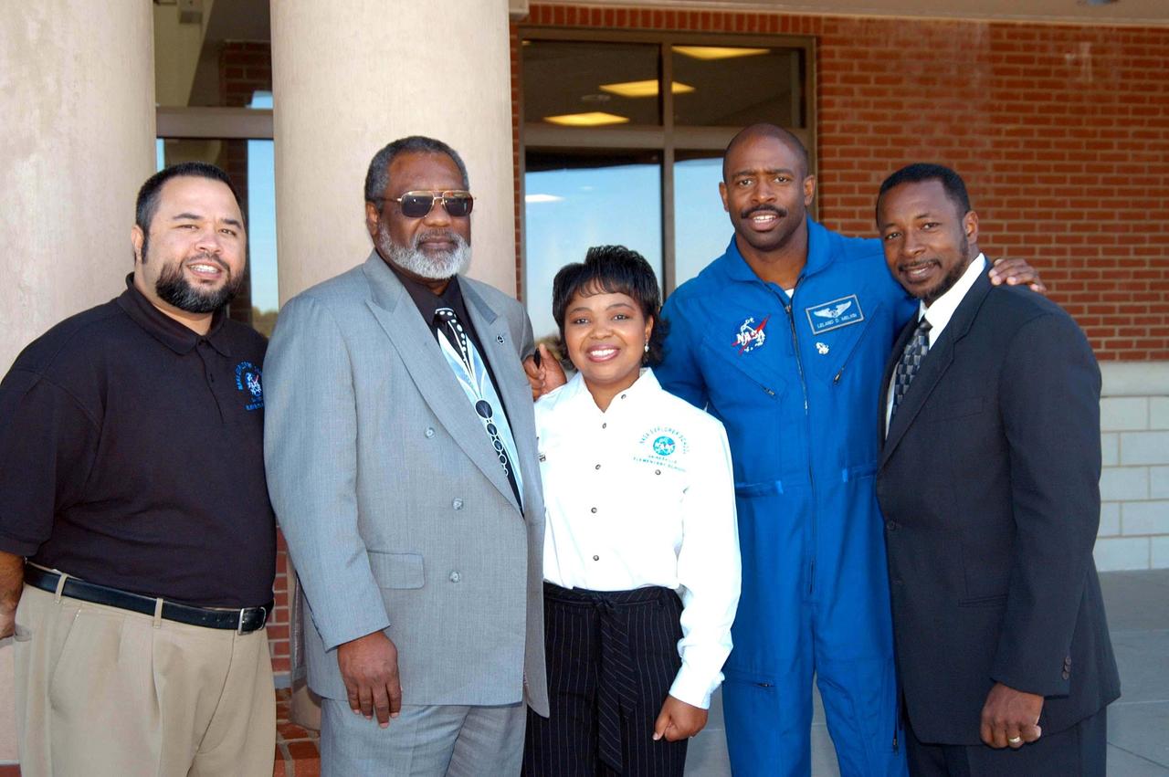 KENNEDY SPACE CENTER, FLA. - Outside Gainesville Elementary School, a NASA Explorer School in Gainesville, Ga., Principal Shawn McCollough (far left) and a staff member pose for this photo with Jim Jennings (second from left), deputy associate administrator for Institutions and Asset Management at NASA Headquarters; astronaut Leland Melvin (second from right); and Dr. Woodrow Whitlow (far right), KSC deputy director. Jennings visited the school to share the new vision for space exploration with the next generation of explorers. Whitlow and Melvin accompanied him and talked with students about our destiny as explorers, NASA’s stepping stone approach to exploring Earth, the Moon, Mars and beyond, how space impacts our lives, and how people and machines rely on each other in space.