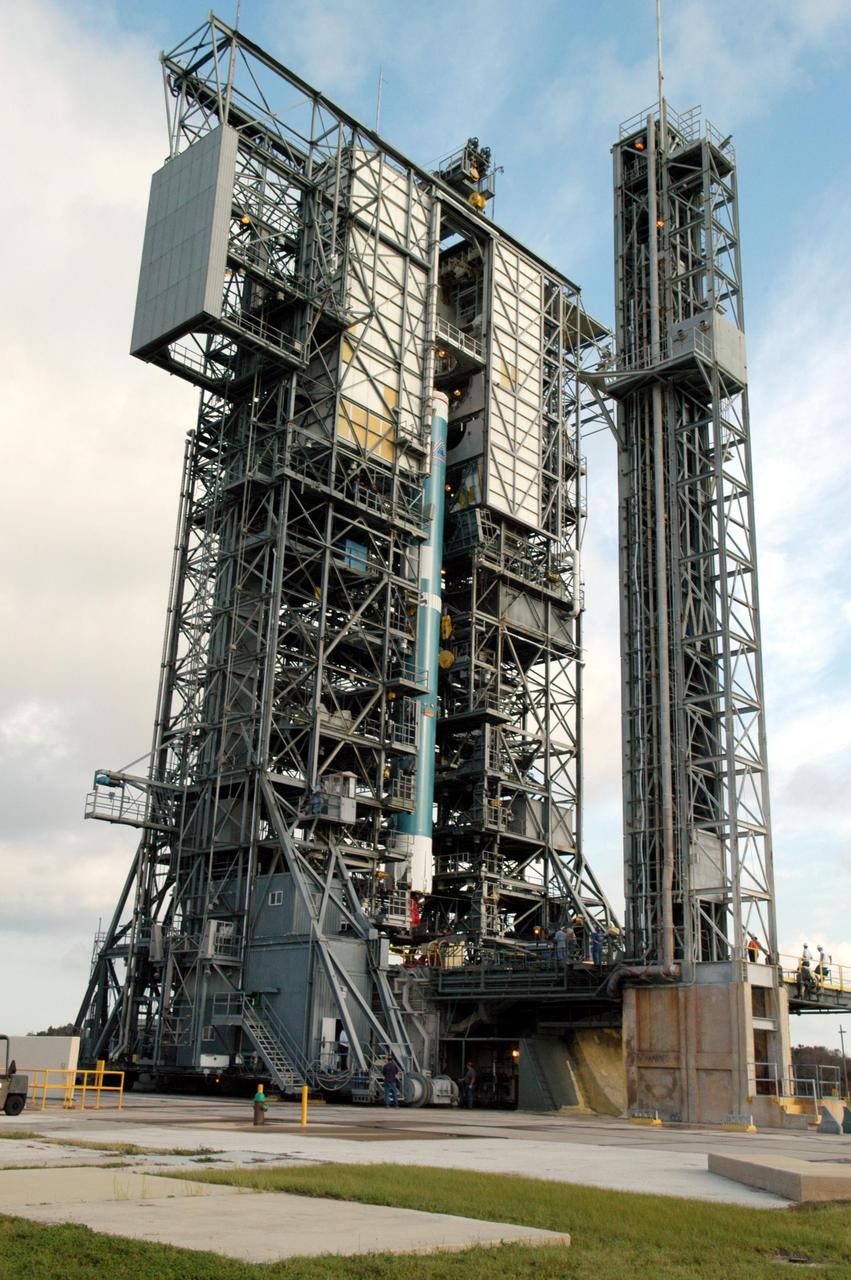 KENNEDY SPACE CENTER, FLA. -  On Launch Complex 17-A at Cape Canaveral Air Force Station, Fla., the first stage of a Boeing Delta II rocket is moved into place in the mobile service tower. To follow in the next week are attachment of the three strap-on solid rocket boosters, lifting of the payload fairing, and lifting of the second stage for mating with the first stage.   The rocket is the launch vehicle for the Swift spacecraft and its Gamma-Ray Burst Mission, now scheduled for liftoff no earlier than Nov. 2.  Swift is a medium-class Explorer mission managed by NASA’s Goddard Space Flight Center in Greenbelt, Md.  The observatory was built for NASA by Spectrum Astro, a division of General Dynamics.  KSC is responsible for Swift’s integration with the Boeing Delta II rocket and the countdown management on launch day.
