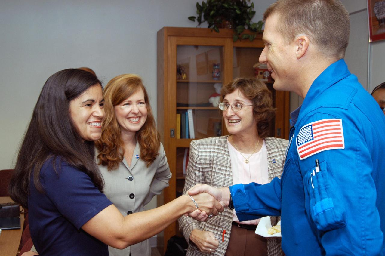 KENNEDY SPACE CENTER, FLA. -  Lisa Scallon (far left), principal of Immokalee Middle School in Naples, Fla., welcomes astronaut Terry Virts to the school, which is part of NASA’s Explorer Schools (NES) Program.  Immokalee and Pine Ridge Middle School are an NES team.  Also seen are Lisa Malone (second from left), director, KSC’s External Relations and Business Development directorate, and Pam Biegert, chief of Educational Services at KSC, who both accompanied Center Director Jim Kennedy on the trip.  Kennedy is visiting the school to share the  for space exploration with the next generation of explorers.  He is talking with students about our destiny as explorers, NASA’s stepping stone approach to exploring Earth, the Moon, Mars and beyond, how space impacts our lives, and how people and machines rely on each other in space.  NES establishes a three-year partnership annually between NASA and 50 NASA Explorer Schools teams, consisting of teachers and education administrators from diverse communities nationwide.