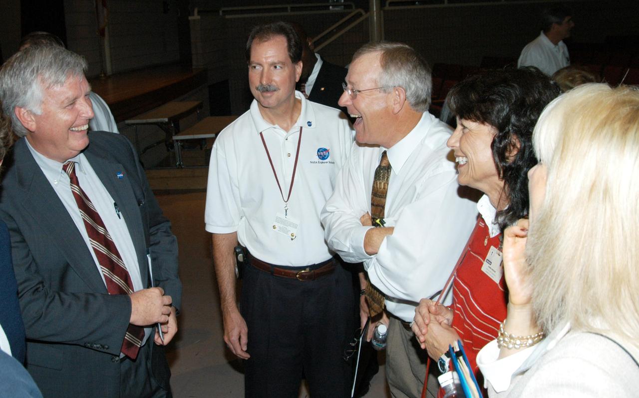 KENNEDY SPACE CENTER, FLA. -  Center Director Jim Kennedy (left) talks to staff members of Immokalee Middle School in Naples, Fla., which is part of NASA’s Explorer School (NES) Program and teamed with Pine Ridge Middle School.  Kennedy visited the school to share the vision for space exploration with the next generation of explorers. He is talking with students about our destiny as explorers, NASA’s stepping stone approach to exploring Earth, the Moon, Mars and beyond, how space impacts our lives, and how people and machines rely on each other in space.  NES establishes a three-year partnership annually between NASA and 50 NASA Explorer Schools teams, consisting of teachers and education administrators from diverse communities nationwide.