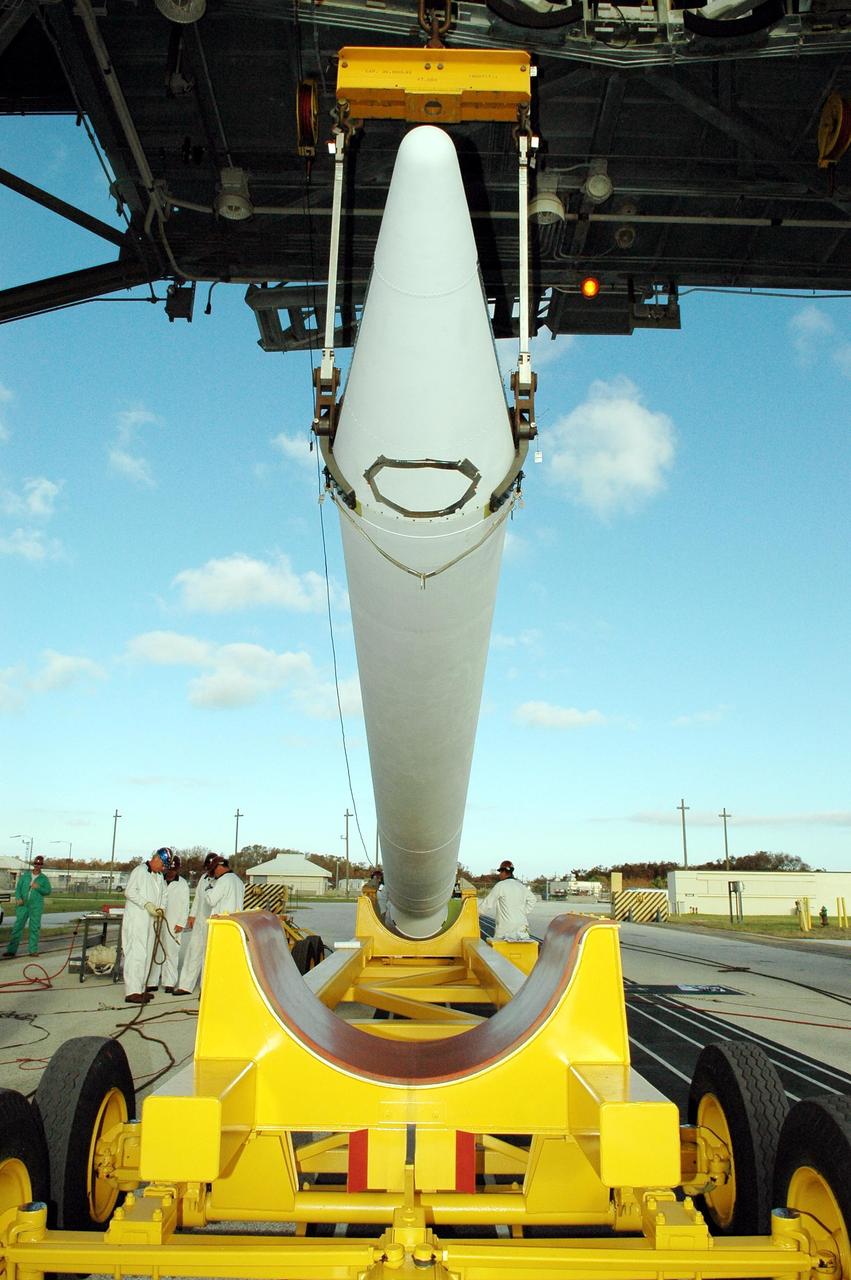 KENNEDY SPACE CENTER, FLA. - A Solid Rocket Booster for the Swift-Delta launch is lifted off its transporter on Pad 17-A at Cape Canaveral Air Force Station. The SRB is one of three to be attached to the Boeing Delta rocket that is the launch vehicle for the Swift spacecraft and its Gamma-Ray Burst Mission. Swift is a medium-class Explorer mission managed by NASA’s Goddard Space Flight Center in Greenbelt, Md.