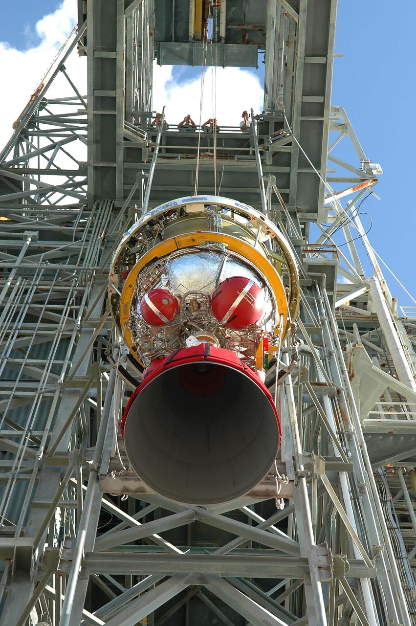 KENNEDY SPACE CENTER, FLA. - At Launch Pad 17-A on Cape Canaveral Air Force Station, the second stage of the Boeing Delta II launch vehicle is being lifted up the mobile service tower for mating with the first stage. The rocket is the launch vehicle for the Swift spacecraft and its Gamma-Ray Burst Mission, now scheduled for liftoff Nov. 8. Swift is a medium-class Explorer mission managed by NASA’s Goddard Space Flight Center in Greenbelt, Md. It is a first-of-its-kind multi-wavelength observatory dedicated to the study of gamma-ray burst (GRB) science. Its three instruments will work together to observe GRBs and afterglows in the gamma ray, X-ray, ultraviolet and optical wavebands. KSC is responsible for Swift’s integration with the Boeing Delta II rocket and the countdown management on launch day.