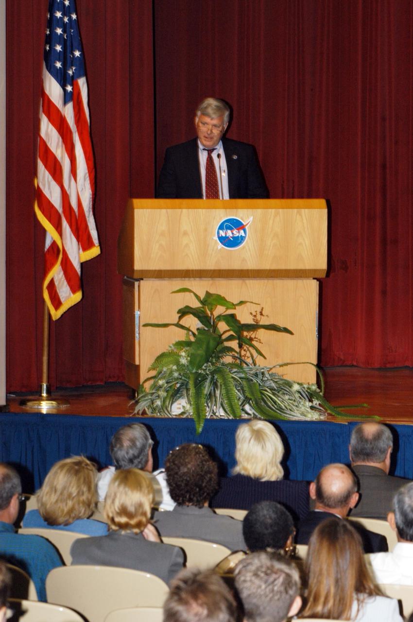 KENNEDY SPACE CENTER, FLA. -   In the NASA Kennedy Space Center Training Auditorium, Center Director Jim Kennedy talks to employees at the kickoff of the 2005 Combined Federal Campaign at the center.  Guest speakers included Janet Bryant, executive director and CEO of the American Red Cross, Brevard County Chapter; Major Jack Owens, commanding officer of the Salvation Army, North/Central Brevard; and Rob Rains, president of United Way of Brevard.  The campaign seeks voluntary donations from Federal civilian, postal and military workers during the campaign season to support eligible nonprofit organizations that provide health and human service benefits throughout the world.