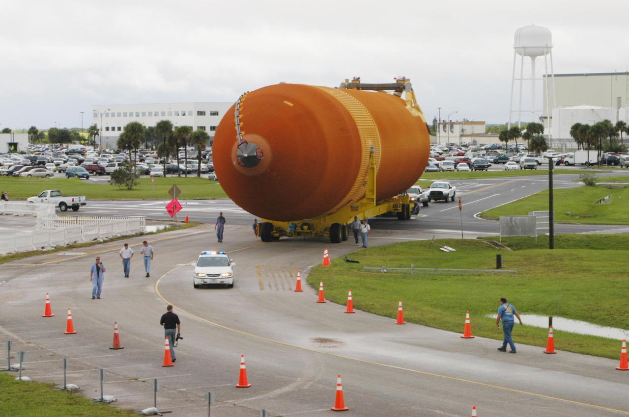 KENNEDY SPACE CENTER, FLA. -  External tank 120 is moved from NASA Kennedy Space Center’s Vehicle Assembly Building to the Turn Basin and the waiting barge Pegasus.  The tank will be loaded onto the barge for transport to NASA’s Michoud Assembly Facility in Louisiana for additional modifications.  Previously, the tank was stacked with Discovery and, more recently, Atlantis.  The tank has already gone through two tanking cycles during tanking tests but was replaced with tank #121 for Discovery’s return to flight mission STS-114.
