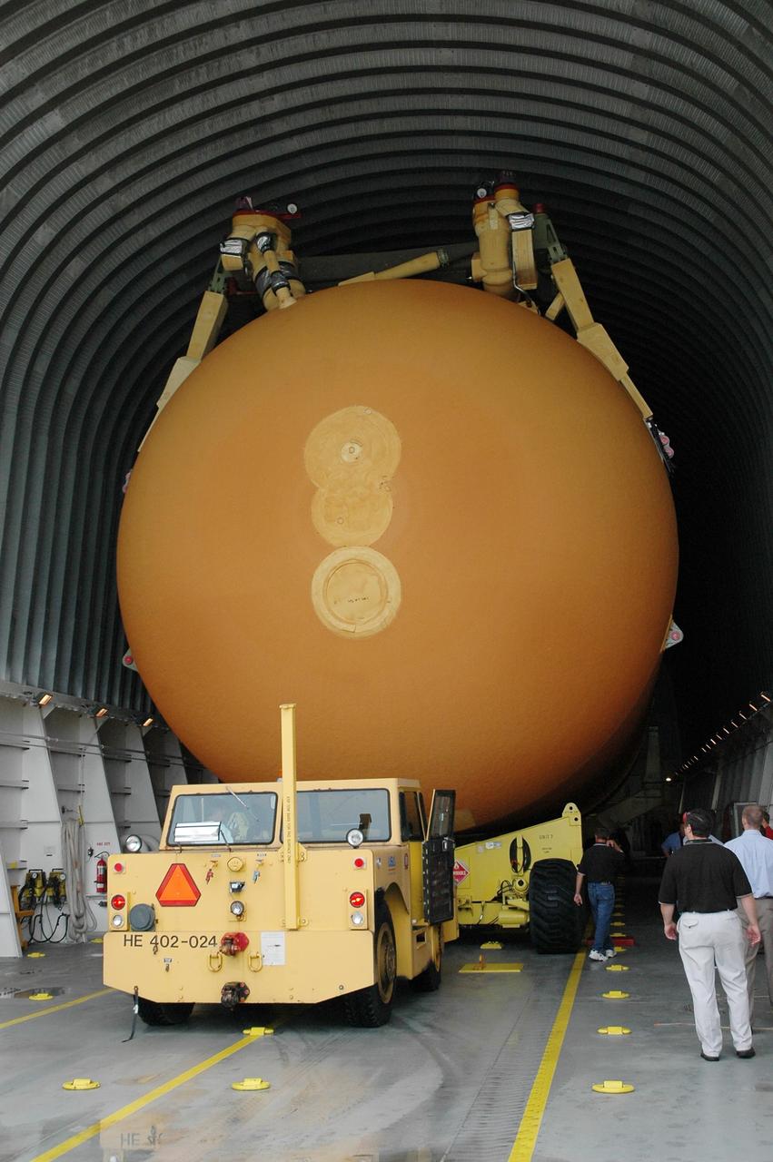 KENNEDY SPACE CENTER, FLA. -  External tank #120, still resting on its transporter, is secured inside the barge Pegasus, docked at the Turn Basin on NASA’s Kennedy Space Center.  The tank and barge will be towed to NASA’s Michoud Assembly Facility in Louisiana for additional modifications.  This tank is the first of the newly designed tanks that were delivered to Kennedy.  Previously, the tank was stacked with Discovery and, more recently, Atlantis.  The tank has already gone through two tanking cycles during tanking tests but was replaced with tank #121 for Discovery’s return to flight mission STS-114.