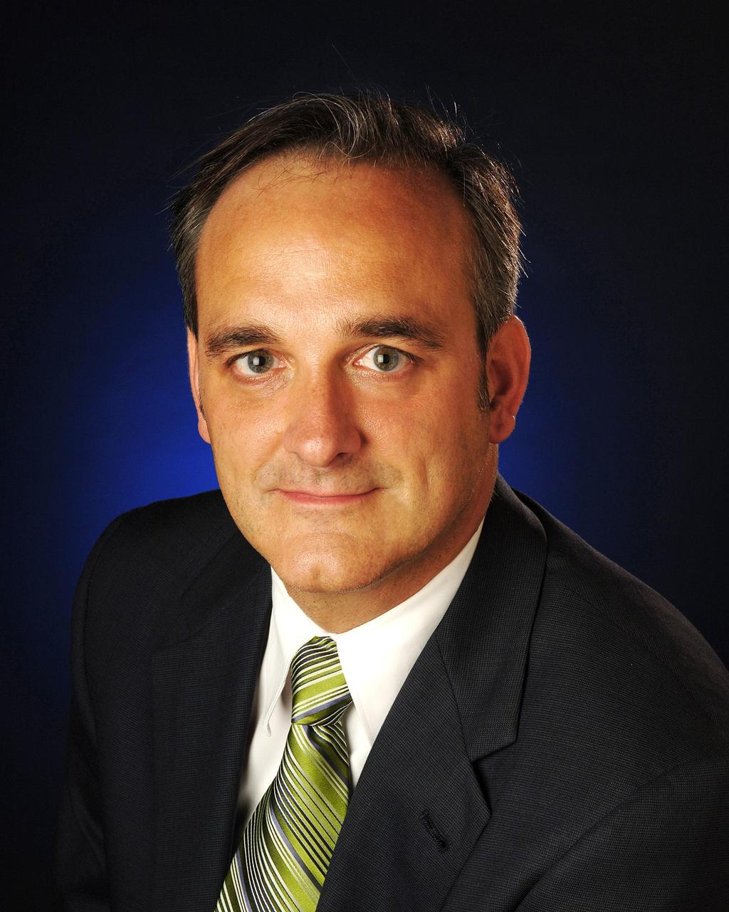 KENNEDY SPACE CENTER, FLA. - Official portrait of Rex Geveden, NASA Associate Administrator. Rex Geveden is the associate administrator of the National Aeronautics and Space Administration. In this position, he is responsible for all technical operations of the Agency. He works directly with the Administrator to develop strategy and policy and has direct oversight of all NASA’s programs and field centers. Photo credit: NASA/Bill Ingalls.