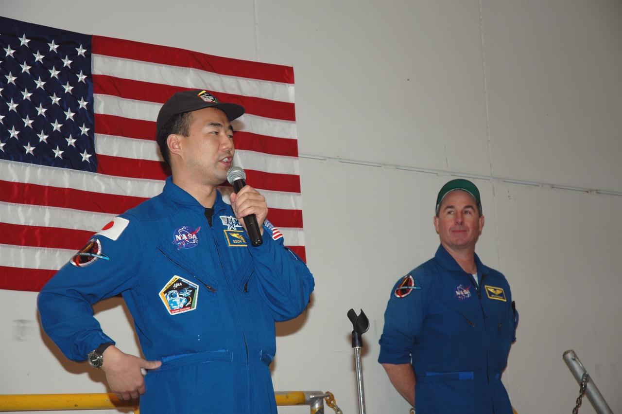 KENNEDY SPACE CENTER, FLA. -  In NASA Kennedy Space Center’s Assembly and  Refurbishment Facility, STS-114 Mission Specialist Soichi Noguchi speaks to employees.  At right is Mission Specialist Stephen Robinson.  They and other crew members are visiting several sites during their return to Kennedy Space Center. They have returned to Florida especially for a celebration in the KSC Visitor Complex of the successful return to flight mission that launched July 26 of this year.