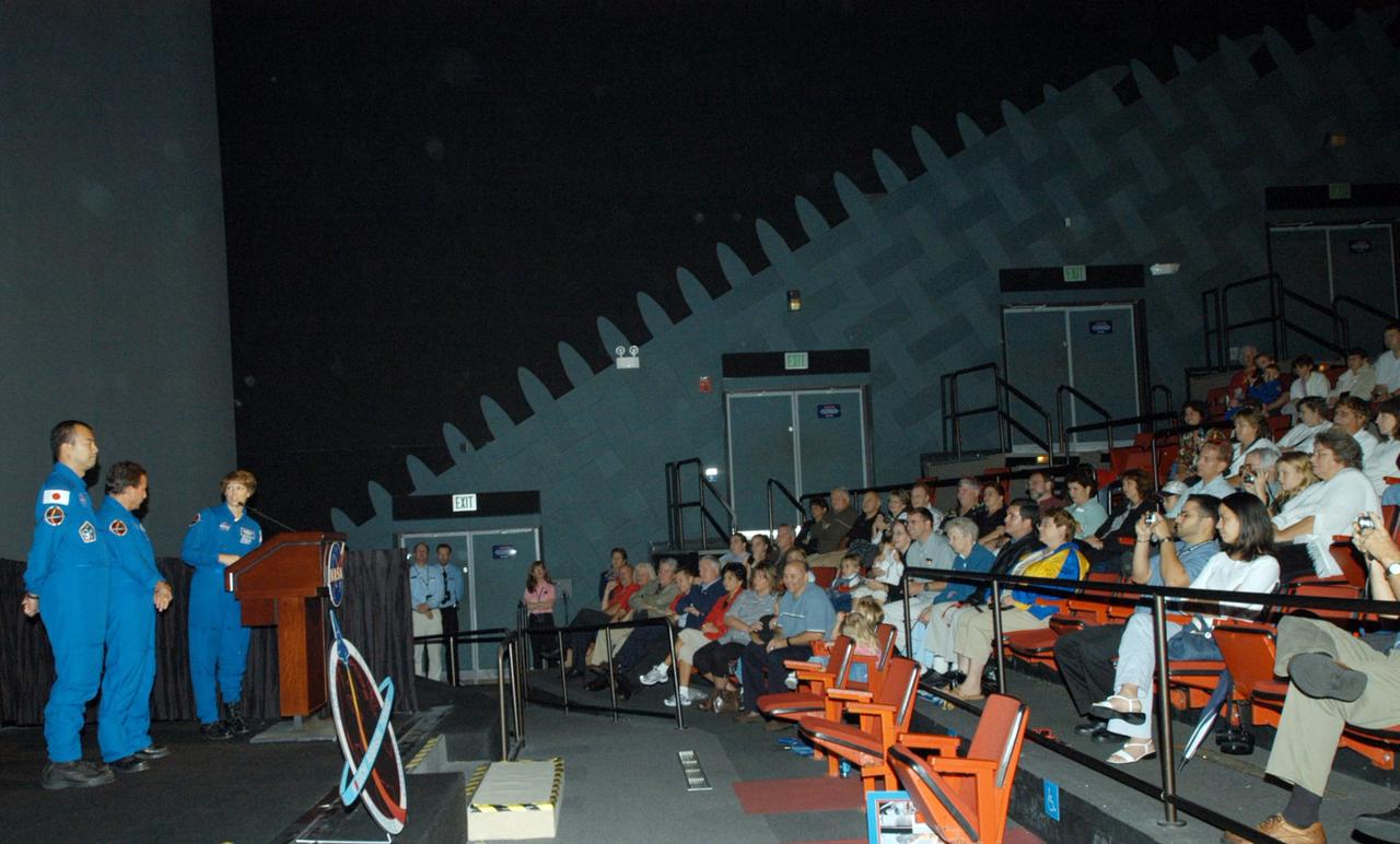KENNEDY SPACE CENTER, FLA. - At a celebration for the STS-114 crew and the successful return to flight mission, members of the crew relate their experiences for an enthusiastic audience of employees and family members in the IMAX Theater. On the stage from left are Mission Specialists Soichi Noguchi and Charles Camarda, and Commander Eileen Collins at the podium. The crew returned to Florida especially for the celebration in the KSC Visitor Complex.