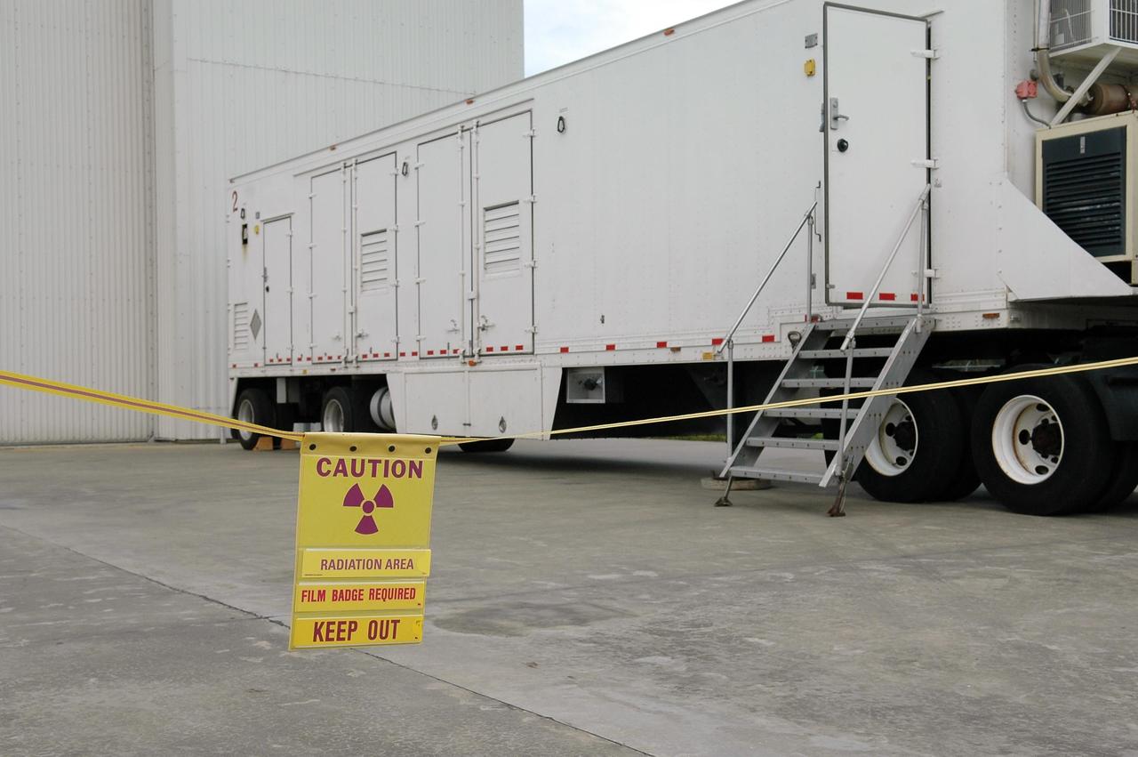 KENNEDY SPACE CENTER, FLA. - The transporter carrying the radioisotope thermoelectric generator (RTG) is closed and ready to move to NASA Kennedy Space Center’s Payload Hazardous Servicing Facility. It will be installed in the New Horizons spacecraft for a fit check. The RTG is the baseline power supply for New Horizons, scheduled to launch in January 2006 on a journey to Pluto and its moon, Charon. It is expected to reach Pluto in July 2015.
