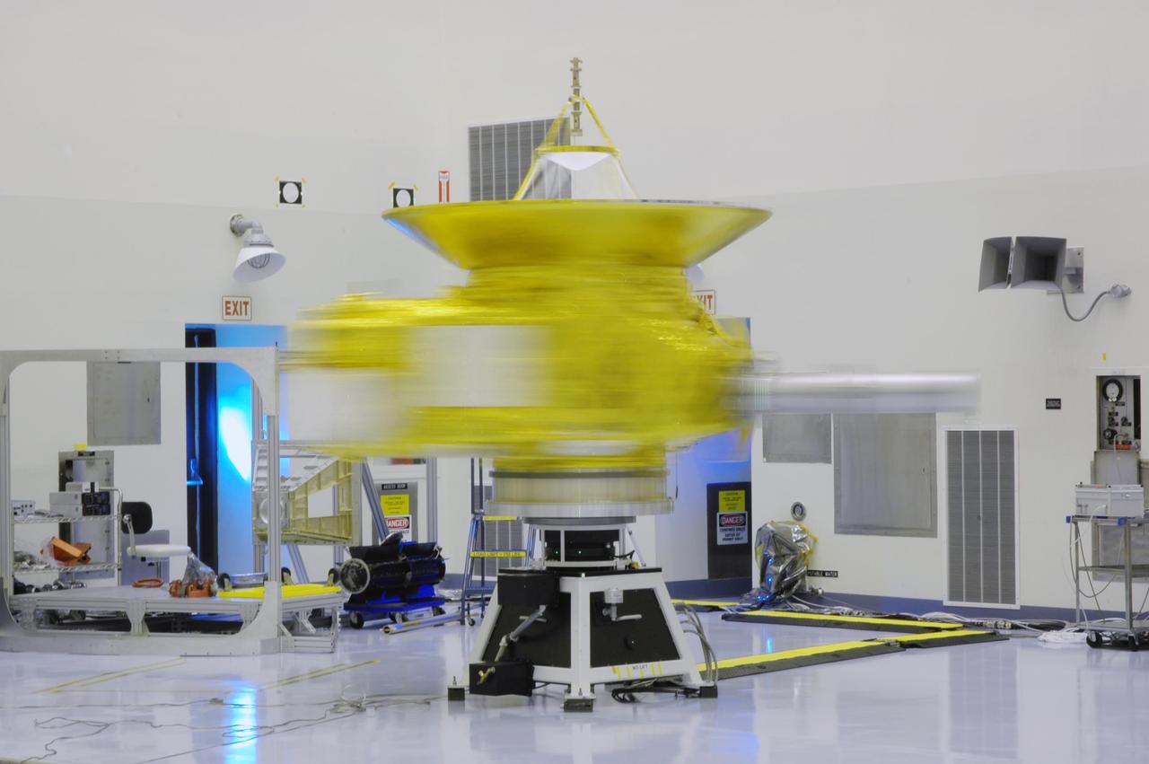 KENNEDY SPACE CENTER, FLA. -  The blurred image of the New Horizons spacecraft is the result of a spin test being conducted in NASA Kennedy Space Center’s Payload Hazardous Servicing Facility.  The spacecraft is undergoing the spin test as part of prelaunch processing.  New Horizons is expected to be launched in January 2006 on a journey to Pluto and its moon, Charon.  It is expected to reach Pluto in July 2015.