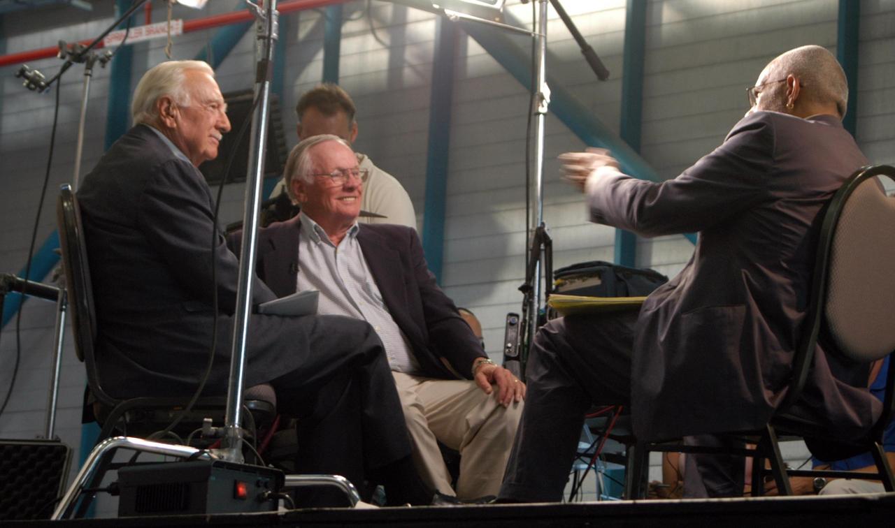 KENNEDY SPACE CENTER, FLA. -   Inside NASA Kennedy Space Center’s Apollo/Saturn V Center, former CBS broadcaster Walter Cronkite (left) and former astronaut Neil Armstrong (center) are interviewed by CBS correspondent Ed Bradley (right).  Armstrong talked about his historic milestone - walking on the moon - and the public’s response and affect on his career afterward. The show aired Nov. 6.
