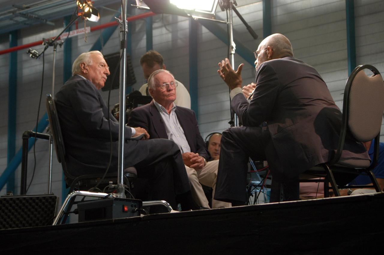 KENNEDY SPACE CENTER, FLA. -  Inside NASA Kennedy Space Center’s Apollo/Saturn V Center, former CBS broadcaster Walter Cronkite (left) and former astronaut Neil Armstrong (center) are interviewed by CBS correspondent Ed Bradley (right).  Armstrong talked about his historic milestone - walking on the moon - and the public’s response and affect on his career afterward. The show aired Nov. 6.