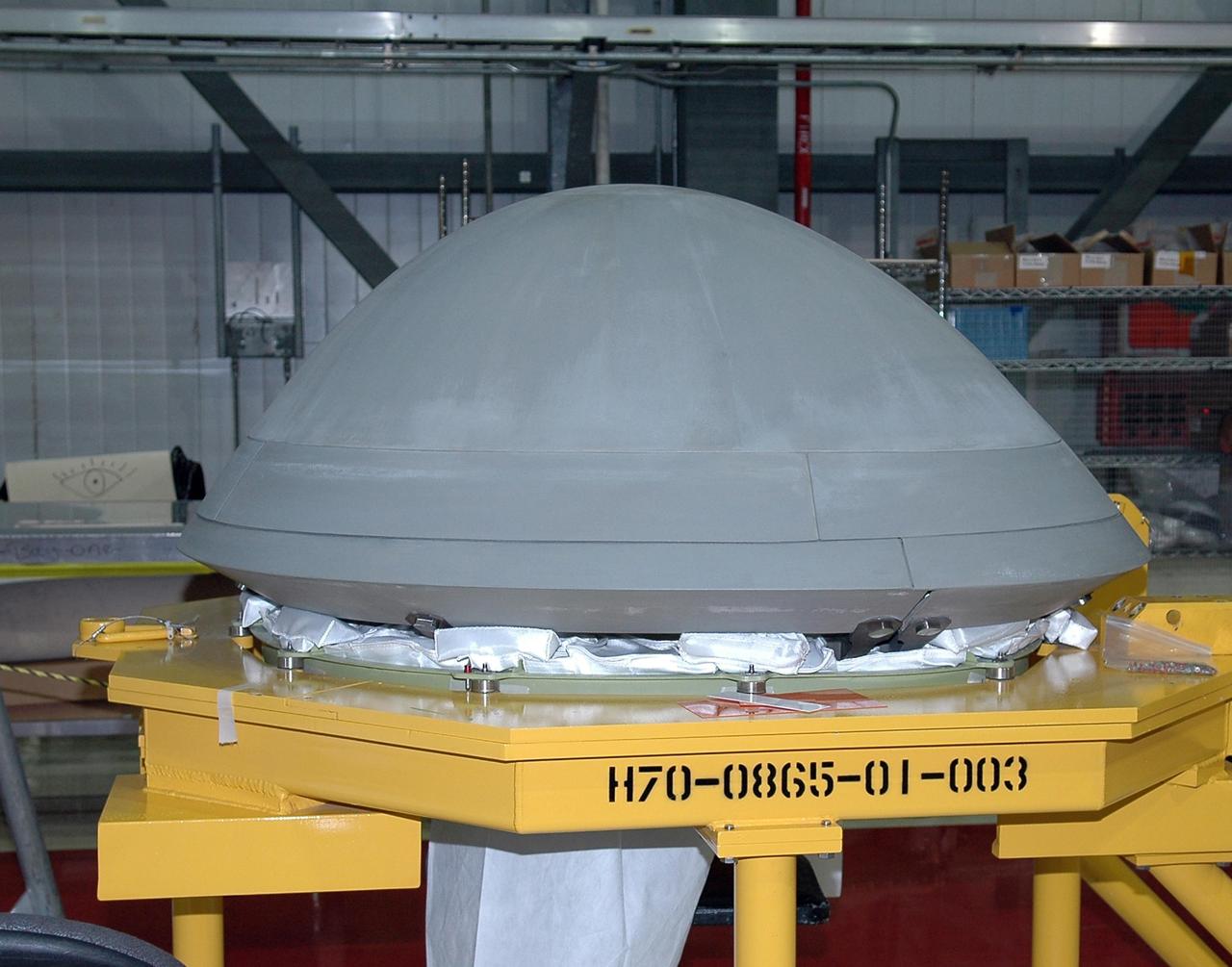 KENNEDY SPACE CENTER, FLA. -   In Orbiter Processing Facility Bay 2, the nose cap of space shuttle Endeavour is prepared for installation of thermal protection system blankets. Endeavour recently came out of a nearly two-year Orbiter Major Modification  period which began in December 2003. Engineers and technicians spent 900,000 hours performing 124 modifications to the vehicle. These included all recommended return-to-flight safety modifications, bonding more than 1,000 thermal protection system tiles and inspecting more than 150 miles of wiring throughout the orbiter. Shuttle major modification periods are scheduled at regular intervals to enhance safety and performance, infuse new technology, and allow for thorough inspections of the airframe and wiring of the vehicles. This was the second of these modification periods performed entirely at Kennedy Space Center. Endeavour's previous modification was completed in March 1997.