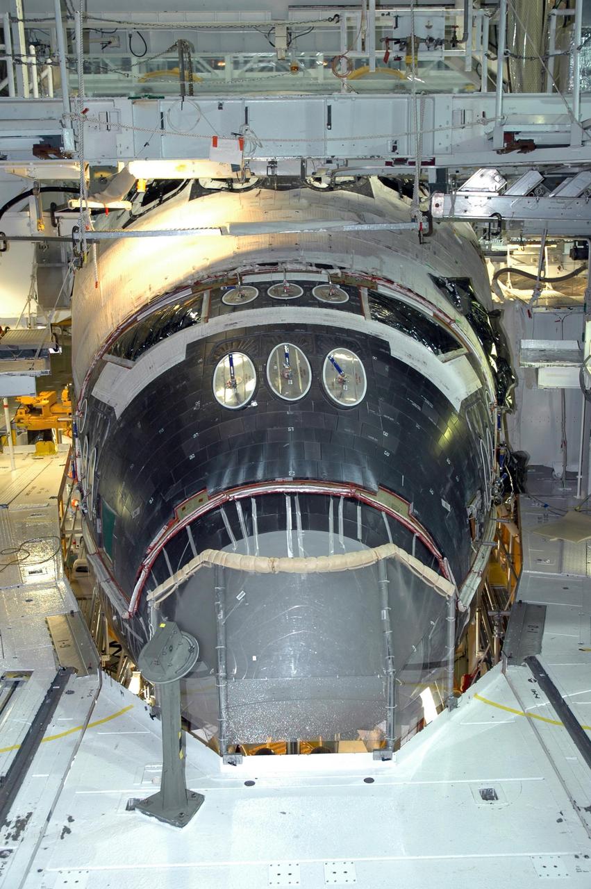 KENNEDY SPACE CENTER, FLA. -- In NASA Kennedy Space Center’s Orbiter Processing Facility Bay 1, installation of the forward reaction control system on Atlantis is complete. The control system fits just behind the nose cone and provides the thrust for attitude (rotational) maneuvers (pitch, yaw and roll) and for small velocity changes along the orbiter axis (translation maneuvers). Processing of Atlantis is under way for mission STS-115, the 19th flight to the International Space Station.