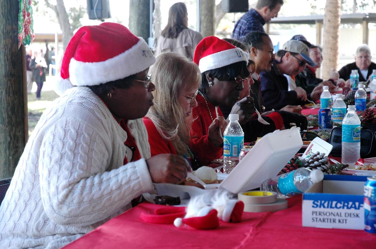 KENNEDY SPACE CENTER, FLA. - NASA Civil Service employees enjoy delicious food, live music and camaraderie at an annual holiday dinner and celebration hosted by Center Director Jim Kennedy at KARS Park I on Merritt Island, Fla. The theme for the celebration was "Launching Dreams of Those in Need." The event was sponsored by the Change Leaders Network and the Combined Federal Campaign Cabinet.