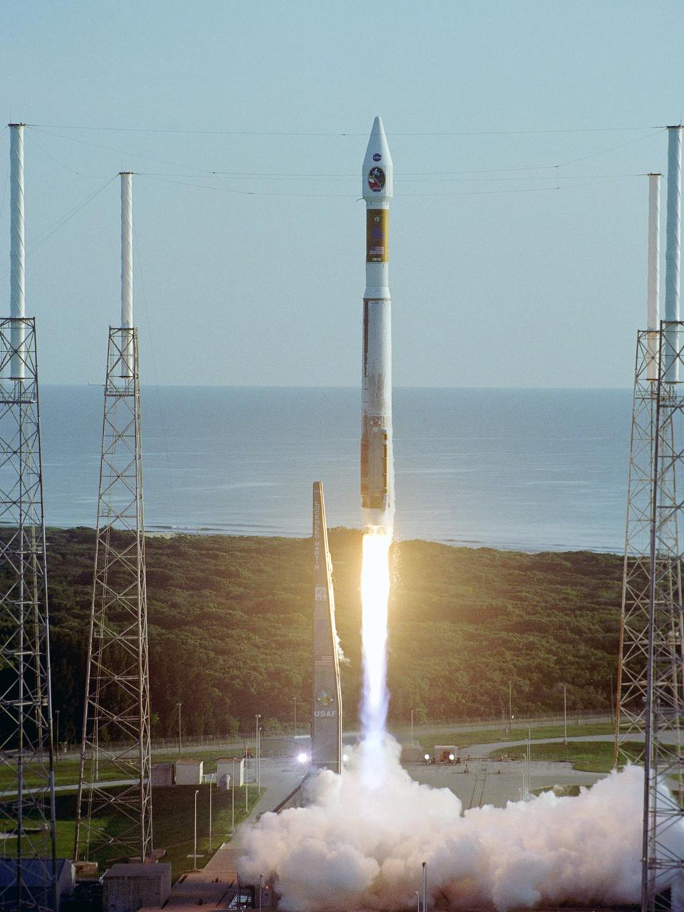 KENNEDY SPACE CENTER, FLA. -   With the Atlantic Ocean as a backdrop, an Atlas V launch vehicle, 19 stories tall, with a two-ton Mars Reconnaissance Orbiter (MRO) on top, roars away from Launch Complex 41 at Cape Canaveral Air Force Station at 7:43 a.m. EDT. All systems performed nominally for NASA's first launch of an Atlas V on an interplanetary mission. MRO established radio contact with controllers 61 minutes after launch and within four minutes of separation from the upper stage. Initial contact came through an antenna at the Japan Aerospace Exploration Agency's Uchinoura Space Center in southern Japan.  Mars is 72 million miles from Earth today, but the spacecraft will travel more than four times that distance on its outbound-arc trajectory to intercept the red planet on March 10, 2006. The orbiter carries six scientific instruments for examining the surface, atmosphere and subsurface of Mars in unprecedented detail from low orbit.  NASA expects to get several times more data about Mars from MRO than from all previous Martian missions combined. Researchers will use the instruments to learn more about the history and distribution of Mars' water. That information will improve understanding of planetary climate change and will help guide the quest to answer whether Mars ever supported life. The orbiter will also evaluate potential landing sites for future missions. (Photo Credit:  Pat Corkery/Lockheed Martin)