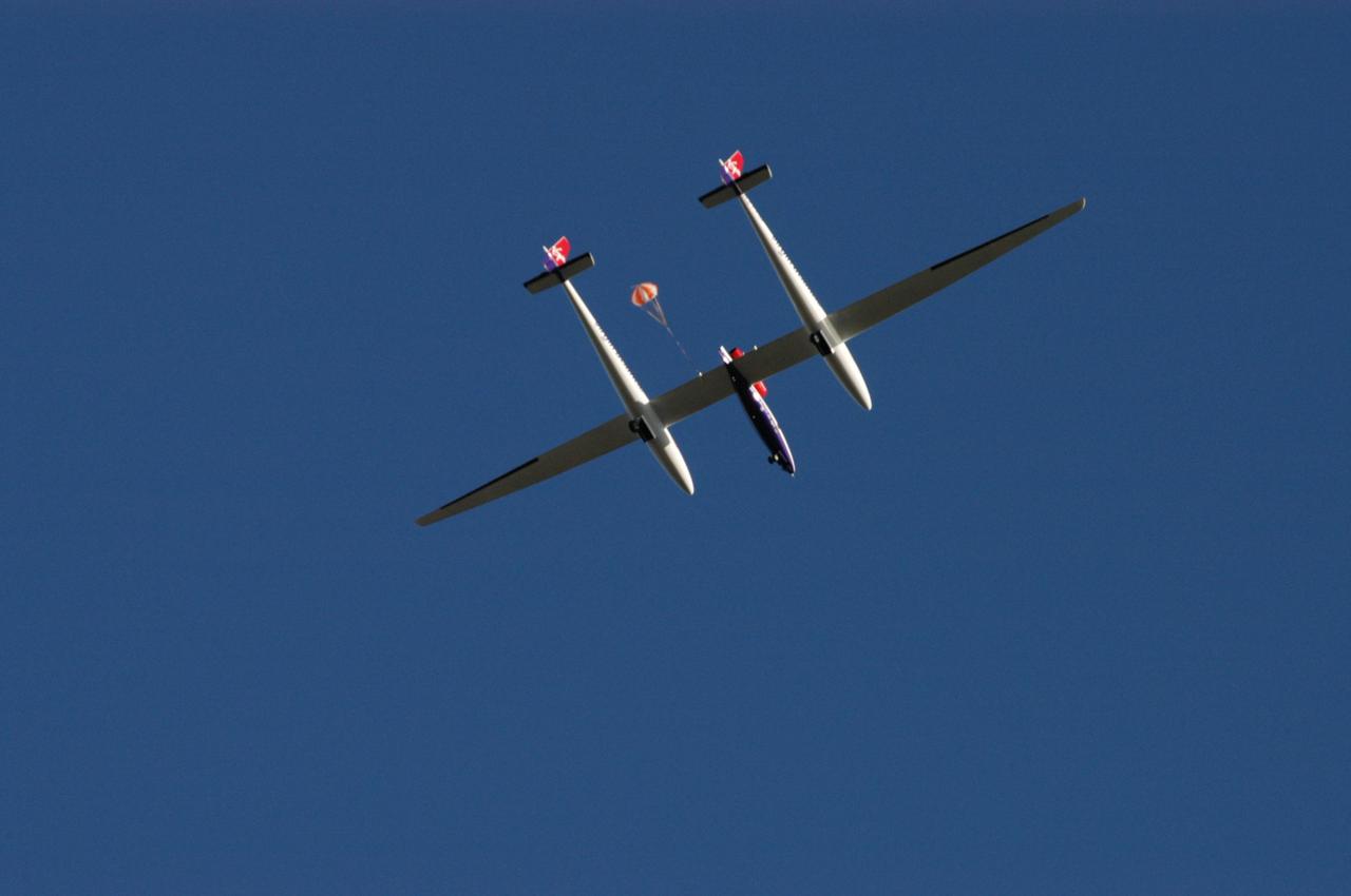 KENNEDY SPACE CENTER, FLA. -  The Virgin Atlantic Airways GlobalFlyer aircraft sails across the sky near NASA Kennedy Space Center’s Shuttle Landing Facility.  The aircraft, piloted by Steve Fossett, is being relocated from Salina, Kan., to the Shuttle Landing Facility to begin preparations for an attempt to set a new world record for the longest flight made by any aircraft. An exact takeoff date for the record-setting flight has not been determined and is contingent on weather and jet-stream conditions. The window for the attempt opens in mid-January, making the flight possible anytime between then and the end of February.  NASA agreed to let Virgin Atlantic Airways use Kennedy's Shuttle Landing Facility as a takeoff site. The facility use is part of a pilot program to expand runway access for non-NASA activities.