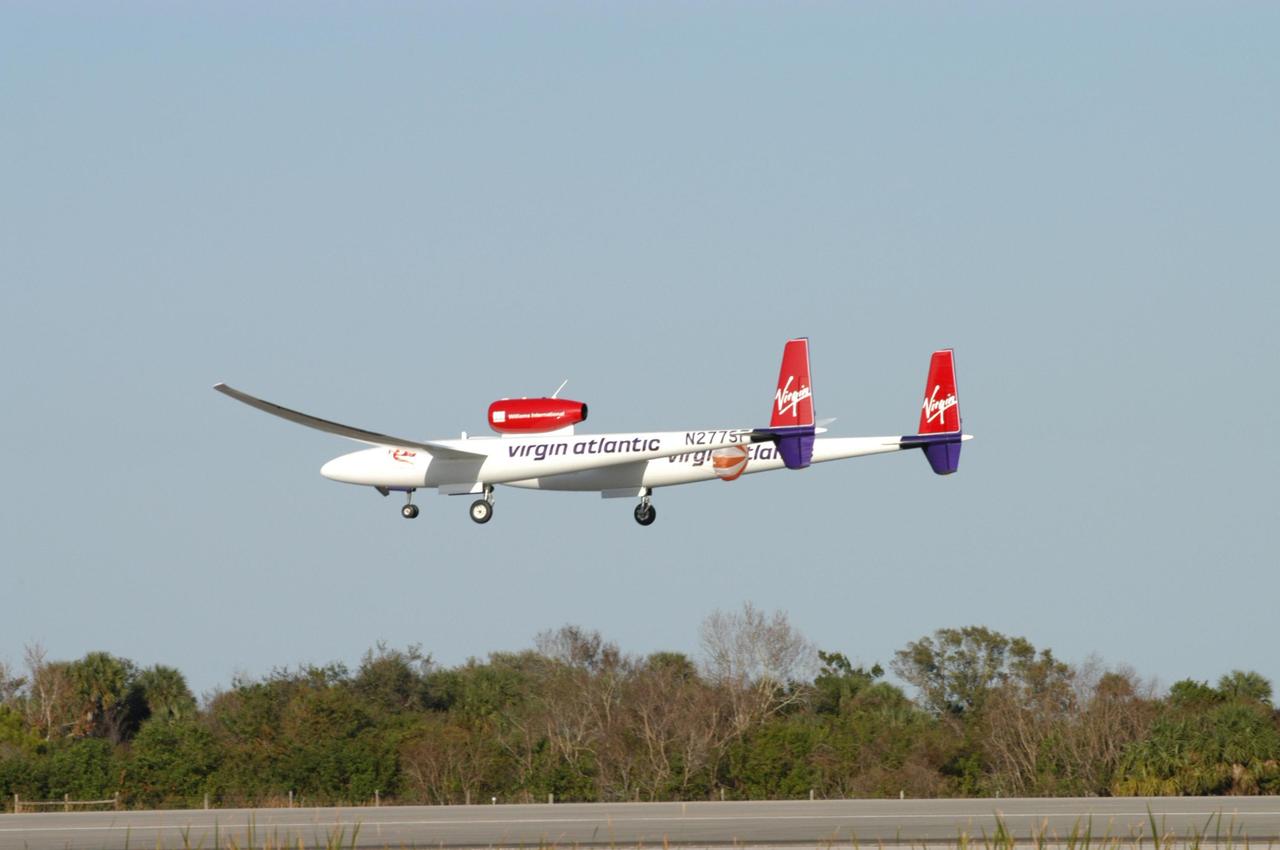 KENNEDY SPACE CENTER, FLA. -   The Virgin Atlantic Airways GlobalFlyer aircraft approaches NASA Kennedy Space Center’s Shuttle Landing Facility for a landing.  The aircraft, piloted by Steve Fossett, is being relocated from Salina, Kan., to the Shuttle Landing Facility to begin preparations for an attempt to set a new world record for the longest flight made by any aircraft. An exact takeoff date for the record-setting flight has not been determined and is contingent on weather and jet-stream conditions. The window for the attempt opens in mid-January, making the flight possible anytime between then and the end of February.  NASA agreed to let Virgin Atlantic Airways use Kennedy's Shuttle Landing Facility as a takeoff site. The facility use is part of a pilot program to expand runway access for non-NASA activities.
