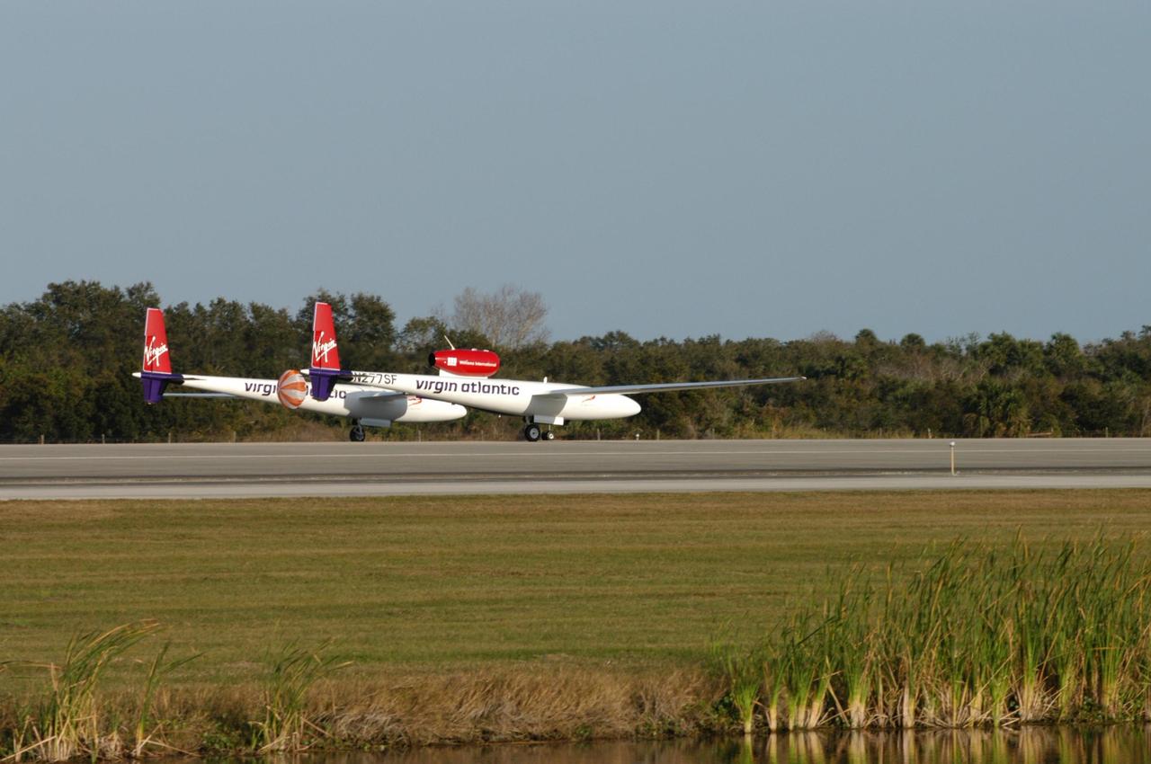 KENNEDY SPACE CENTER, FLA. -   The Virgin Atlantic Airways GlobalFlyer aircraft touches down on NASA Kennedy Space Center’s Shuttle Landing Facility.  The aircraft, piloted by Steve Fossett, is being relocated from Salina, Kan., to the Shuttle Landing Facility to begin preparations for an attempt to set a new world record for the longest flight made by any aircraft. An exact takeoff date for the record-setting flight has not been determined and is contingent on weather and jet-stream conditions. The window for the attempt opens in mid-January, making the flight possible anytime between then and the end of February.  NASA agreed to let Virgin Atlantic Airways use Kennedy's Shuttle Landing Facility as a takeoff site. The facility use is part of a pilot program to expand runway access for non-NASA activities.