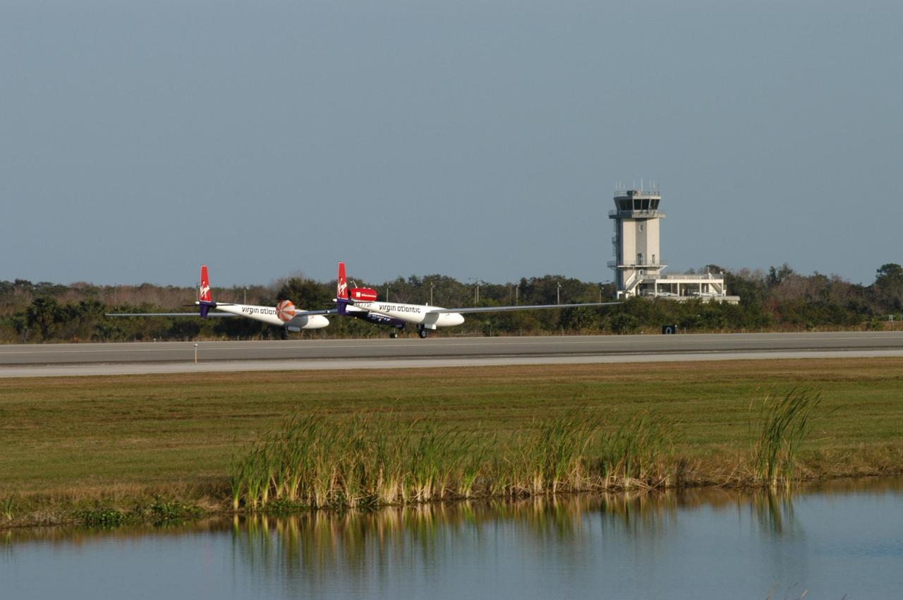 KENNEDY SPACE CENTER, FLA. -    The Virgin Atlantic Airways GlobalFlyer aircraft lands on NASA Kennedy Space Center’s Shuttle Landing Facility. The aircraft, piloted by Steve Fossett, is being relocated from Salina, Kan., to the Shuttle Landing Facility to begin preparations for an attempt to set a new world record for the longest flight made by any aircraft. An exact takeoff date for the record-setting flight has not been determined and is contingent on weather and jet-stream conditions. The window for the attempt opens in mid-January, making the flight possible anytime between then and the end of February.  NASA agreed to let Virgin Atlantic Airways use Kennedy's Shuttle Landing Facility as a takeoff site. The facility use is part of a pilot program to expand runway access for non-NASA activities.