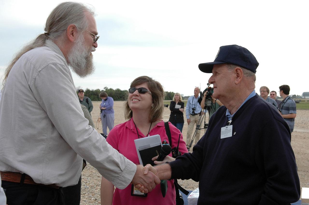 KENNEDY SPACE CENTER, FLA. - On the occasion of the 40th anniversary of the crawler transporter used for moving space shuttles to the NASA Kennedy Space Center’s launch pads, Philip Koehring Jr. (left) meets Bill Clemens. Koehring represented his father, who was project manager at Marion Power Shovel Co. in Ohio where the crawlers were initially built in 1965. Media representatives and invited guests had the opportunity to tour one of NASA's two crawlers. This included the driver cab and engine room. Guests included current drivers and operators, as well as drivers from the Apollo Program. In January 1966, the crawler completed its first successful move with a 10.6-million-pound launch umbilical tower. It moved three-quarters of a mile in about nine hours. Throughout 40 years of service, the two crawlers have moved more than 3,500 miles and carried seven vehicles.