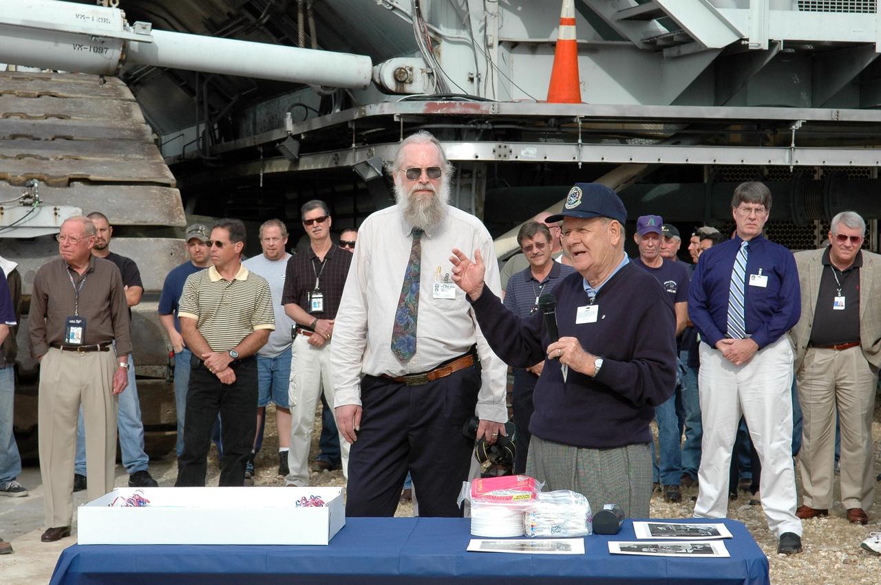KENNEDY SPACE CENTER, FLA. - On the occasion of the 40th anniversary of the crawler transporter used for moving space shuttles to the NASA Kennedy Space Center’s launch pads, former crawler engineer Bill Clemens (right) introduces Philip Koehring Jr., whose father was project manager at the Marion Power Shovel Co. in Ohio where the crawlers were initially built in 1965. Media representatives and invited guests had the opportunity to tour one of NASA's two crawlers. This included the driver cab and engine room. Guests included current drivers and operators, as well as drivers from the Apollo Program. In January 1966, the crawler completed its first successful move with a 10.6-million-pound launch umbilical tower. It moved three-quarters of a mile in about nine hours. Throughout 40 years of service, the two crawlers have moved more than 3,500 miles and carried seven vehicles.