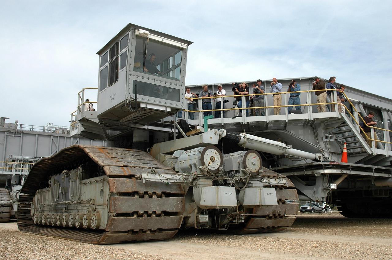 KENNEDY SPACE CENTER, FLA. - On the occasion of the 40th anniversary of the crawler transporter used for moving space shuttles to the NASA Kennedy Space Center’s launch pads, media get a rare opportunity to ride on and photograph one of the crawlers up close. Media representatives and invited guests had the opportunity to tour one of NASA's two crawlers. This included the driver cab and engine room. Guests included current drivers and operators, as well as drivers from the Apollo Program. In January 1966, the crawler completed its first successful move with a 10.6-million-pound launch umbilical tower. It moved three-quarters of a mile in about nine hours. Throughout 40 years of service, the two crawlers have moved more than 3,500 miles and carried seven vehicles.