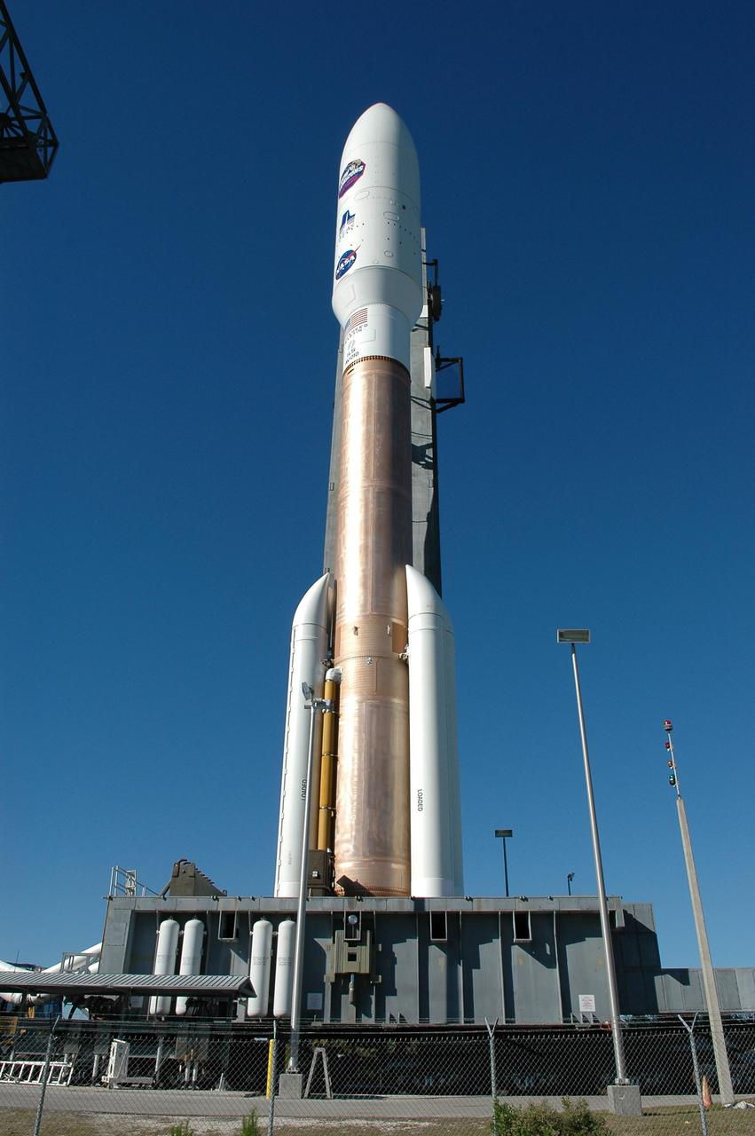 KENNEDY SPACE CENTER, FLA. - On Complex 41 at Cape Canaveral Air Force Station, the Atlas V expendable launch vehicle with the New Horizons spacecraft is being moved from the Vertical Integration Facility to the pad. The liftoff is scheduled for 1:24 p.m. EST Jan. 17. After its launch aboard the Atlas V, the compact, 1,050-pound piano-sized probe will get a boost from a kick-stage solid propellant motor for its journey to Pluto. New Horizons will be the fastest spacecraft ever launched, reaching lunar orbit distance in just nine hours and passing Jupiter 13 months later. The New Horizons science payload, developed under direction of Southwest Research Institute, includes imaging infrared and ultraviolet spectrometers, a multi-color camera, a long-range telescopic camera, two particle spectrometers, a space-dust detector and a radio science experiment. The dust counter was designed and built by students at the University of Colorado, Boulder. A launch before Feb. 3 allows New Horizons to fly past Jupiter in early 2007 and use the planet’s gravity as a slingshot toward Pluto. The Jupiter flyby trims the trip to Pluto by as many as five years and provides opportunities to test the spacecraft’s instruments and flyby capabilities on the Jupiter system. New Horizons could reach the Pluto system as early as mid-2015, conducting a five-month-long study possible only from the close-up vantage of a spacecraft.