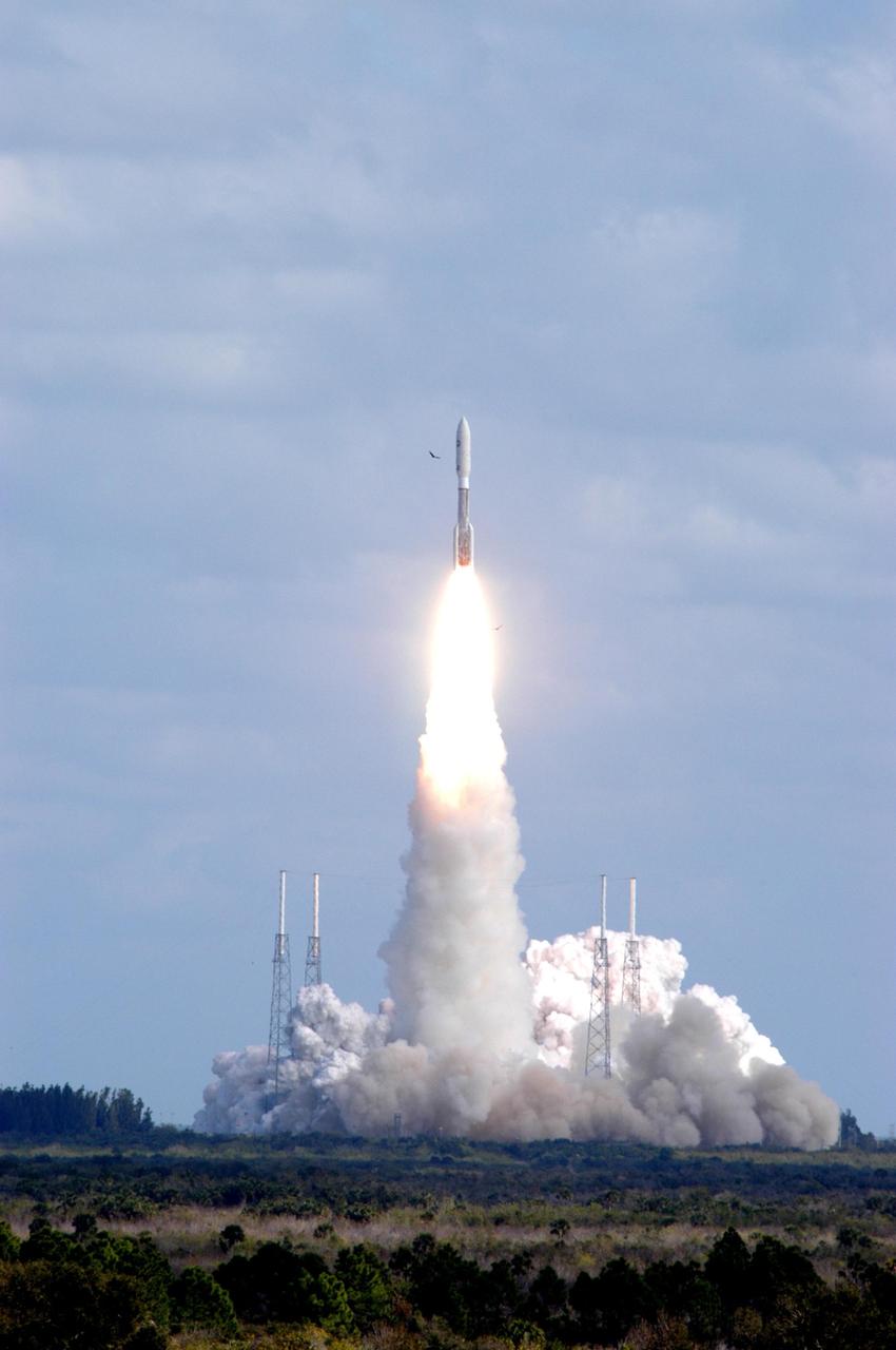 KENNEDY SPACE CENTER, FLA. — Viewed from a nearby vantage point, NASA’s New Horizons spacecraft roars into the cloud-scattered sky trailing fire and smoke from the Atlas V rocket that propels it. Liftoff was on time at 2 p.m. EST from Complex 41 on Cape Canaveral Air Force Station in Florida. This was the third launch attempt in as many days after scrubs due to weather concerns. The compact, 1,050-pound piano-sized probe will get a boost from a kick-stage solid propellant motor for its journey to Pluto. New Horizons will be the fastest spacecraft ever launched, reaching lunar orbit distance in just nine hours and passing Jupiter 13 months later. The New Horizons science payload, developed under direction of Southwest Research Institute, includes imaging infrared and ultraviolet spectrometers, a multi-color camera, a long-range telescopic camera, two particle spectrometers, a space-dust detector and a radio science experiment. The dust counter was designed and built by students at the University of Colorado, Boulder. The launch at this time allows New Horizons to fly past Jupiter in early 2007 and use the planet’s gravity as a slingshot toward Pluto. The Jupiter flyby trims the trip to Pluto by as many as five years and provides opportunities to test the spacecraft’s instruments and flyby capabilities on the Jupiter system. New Horizons could reach the Pluto system as early as mid-2015, conducting a five-month-long study possible only from the close-up vantage of a spacecraft. Photo credit: NASA/George Shelton